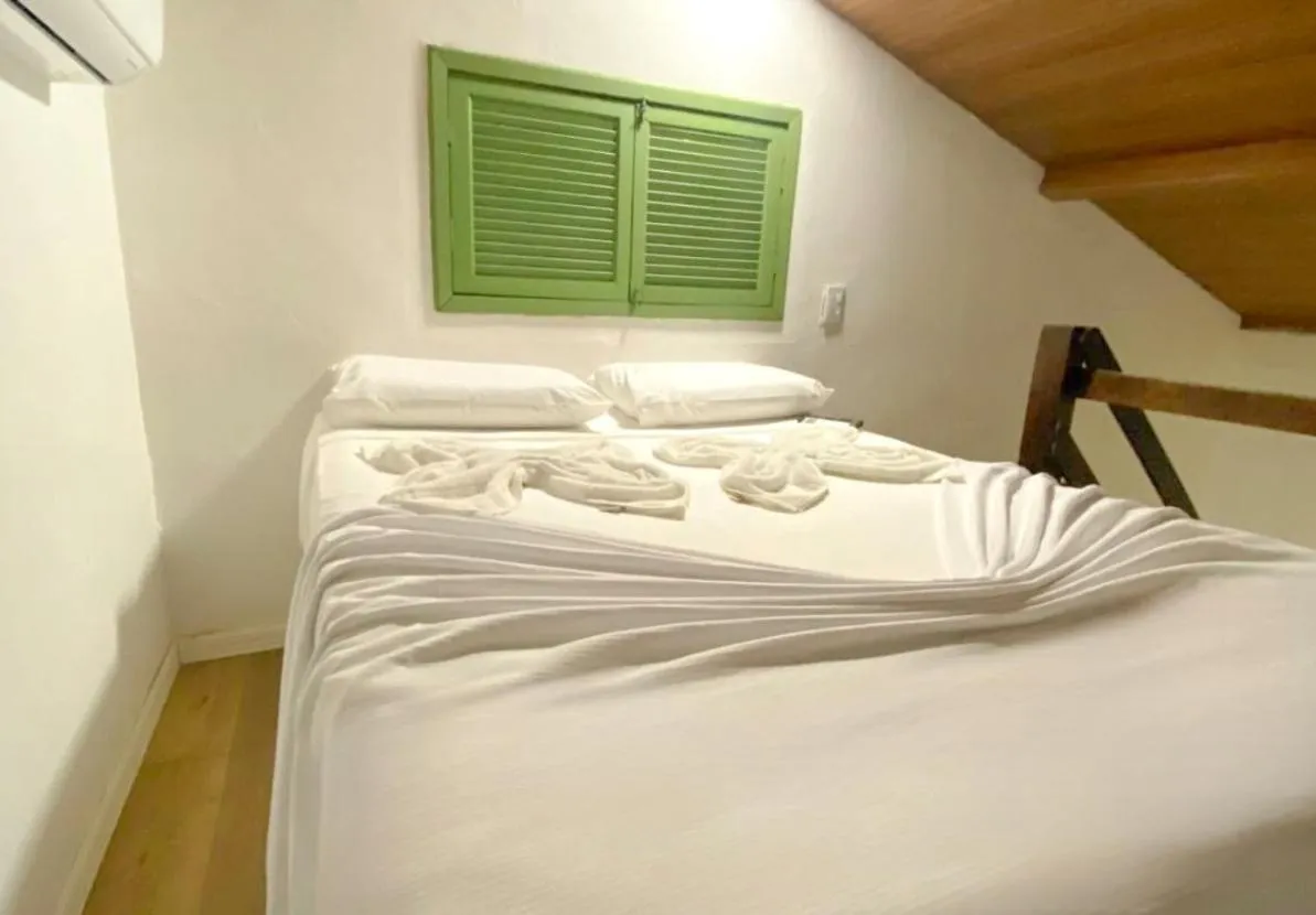 Bed in Pousada Maracaju