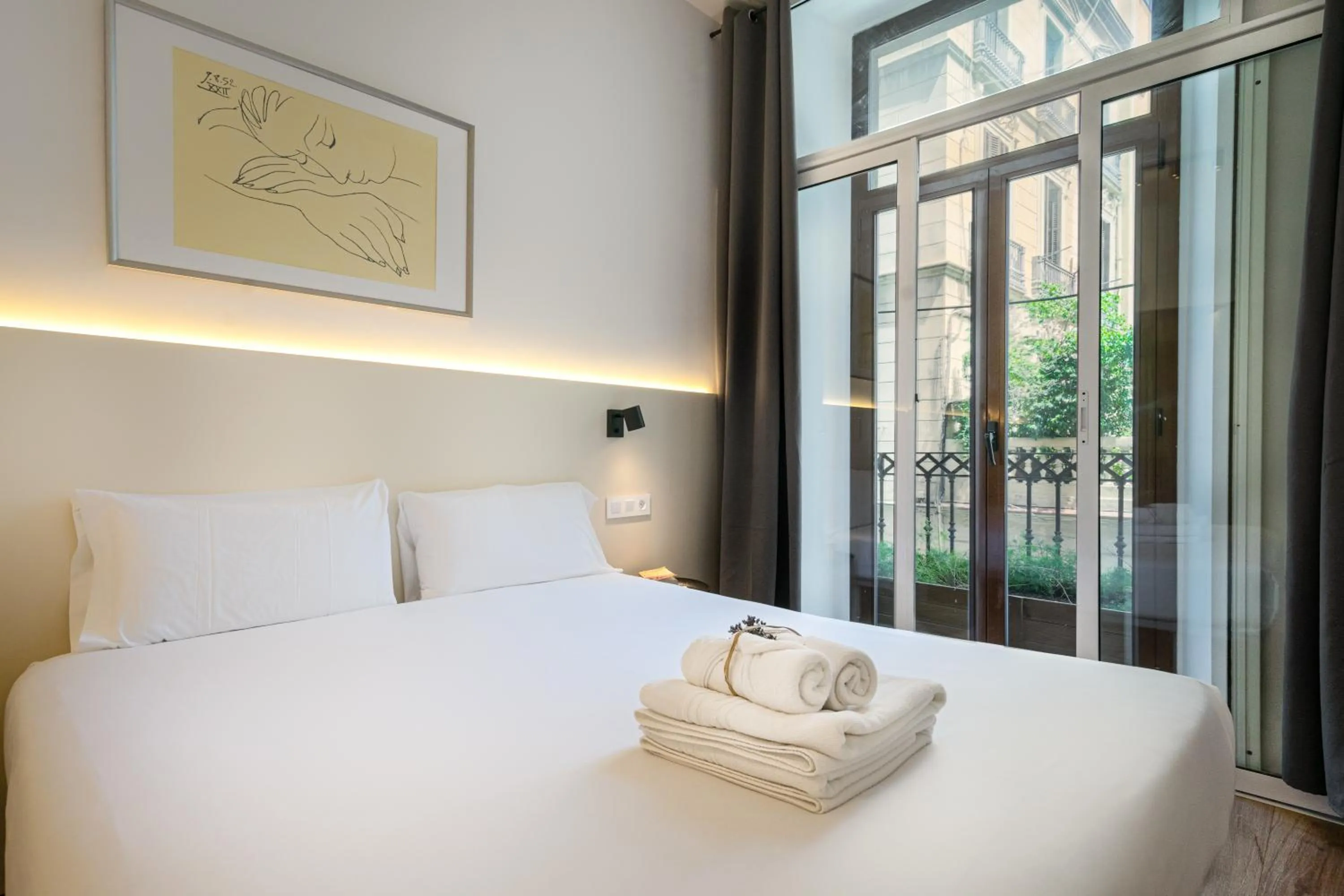 Bed in Happy Apartments