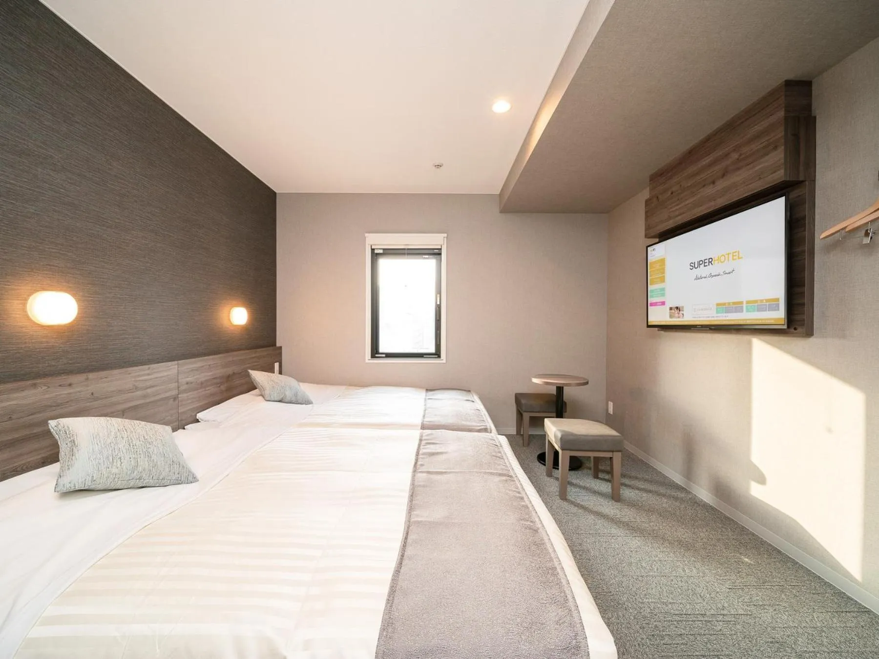 Bed in Super Hotel Premier Nagoya Sakuradoriguchi