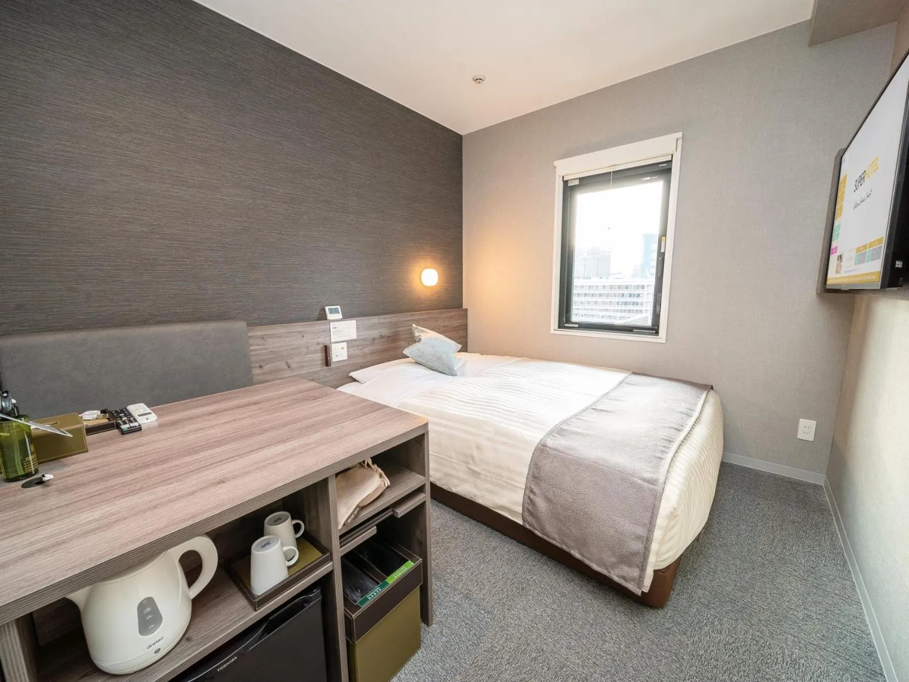 Bed in Super Hotel Premier Nagoya Sakuradoriguchi