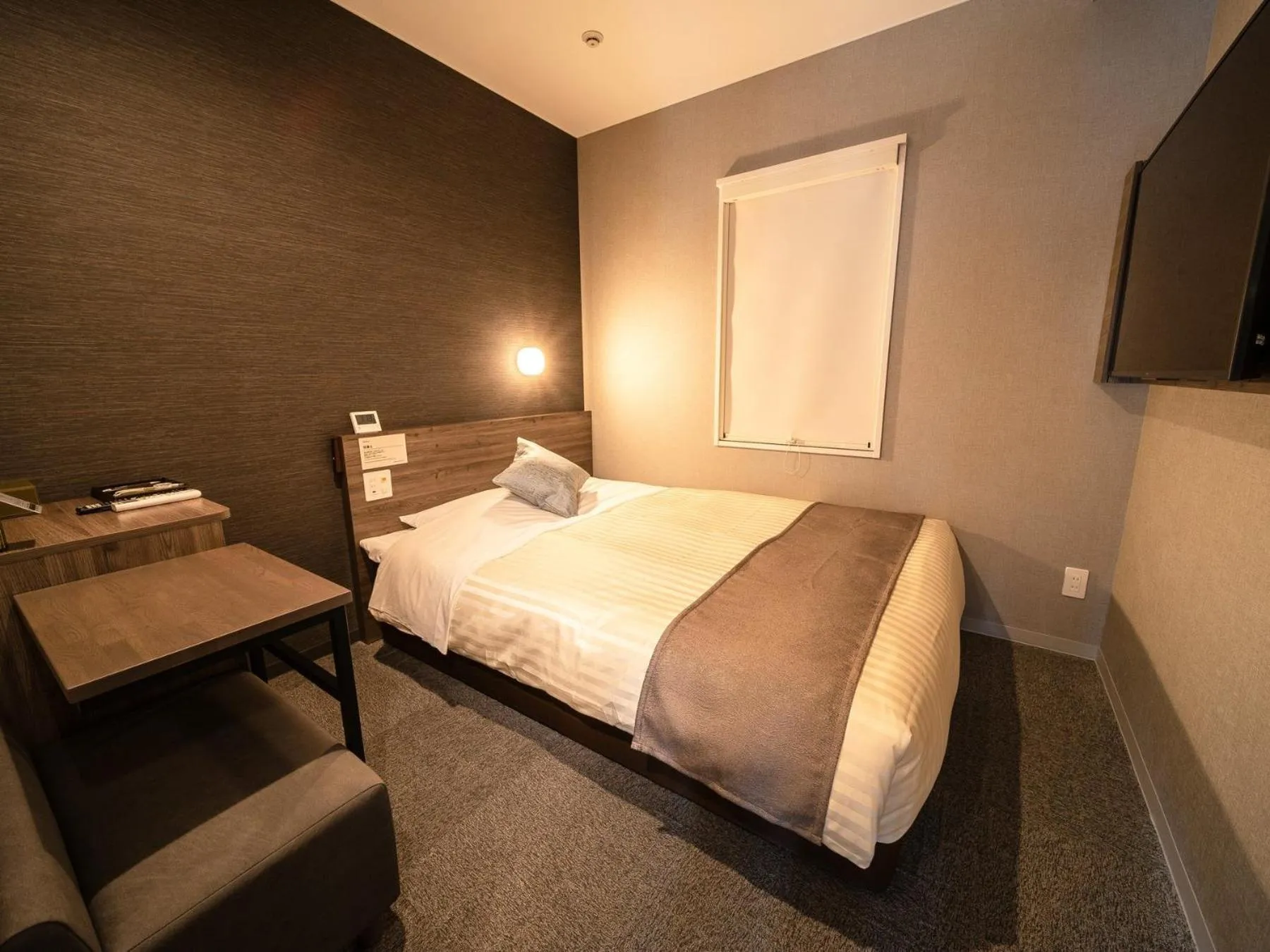 Bed in Super Hotel Premier Nagoya Sakuradoriguchi