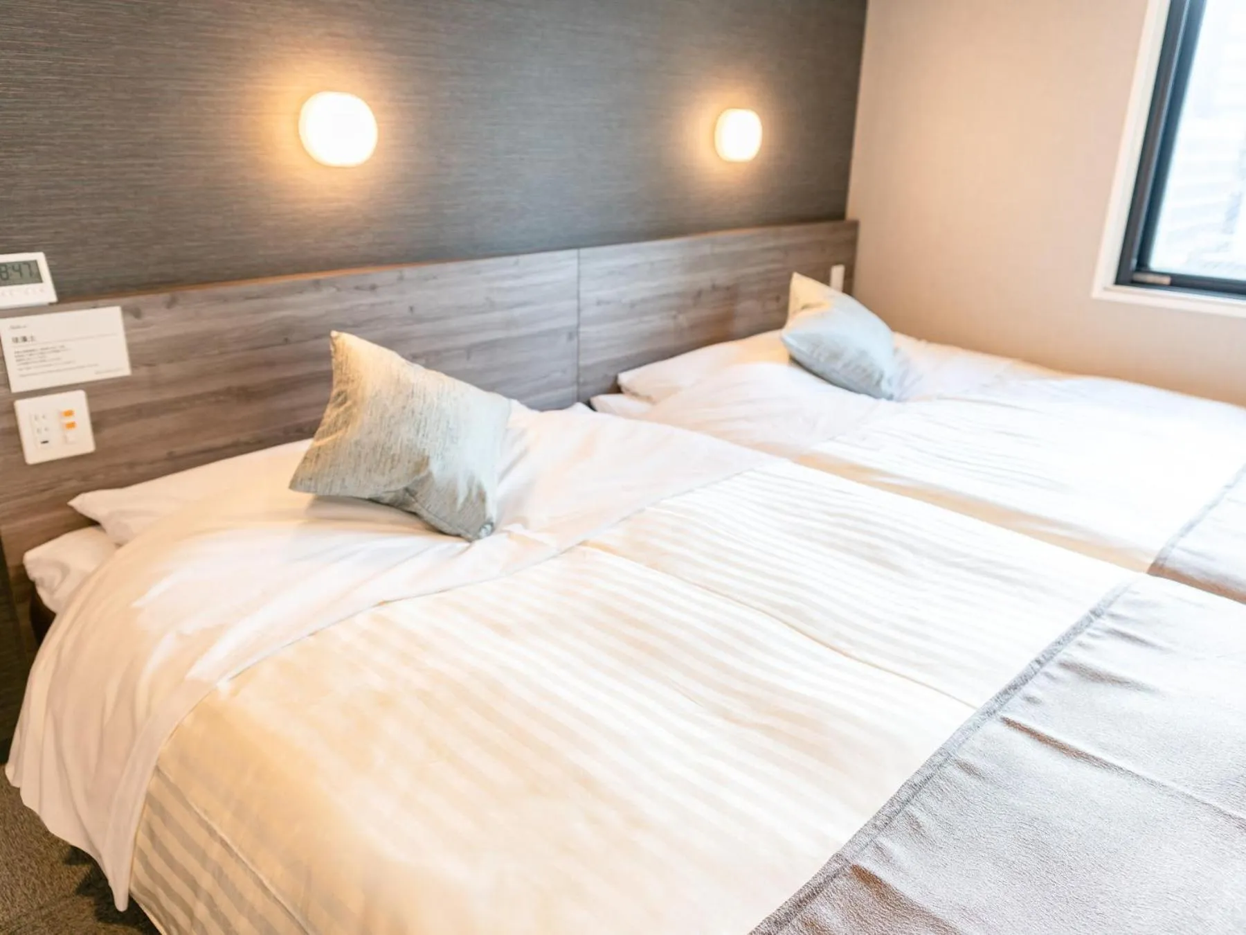 Bed in Super Hotel Premier Nagoya Sakuradoriguchi