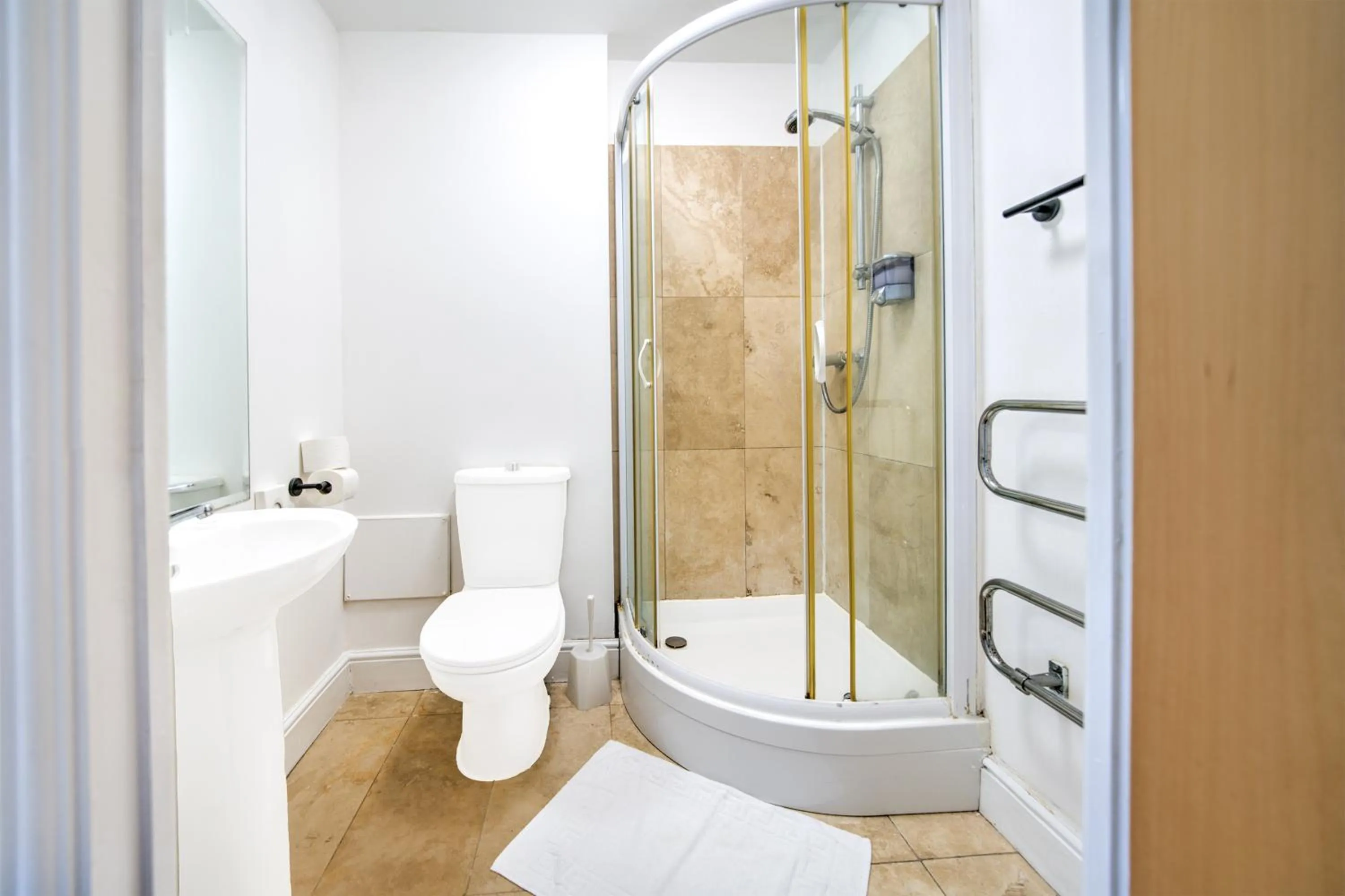 Bathroom in GO2 Gloucester Hotel by OYO