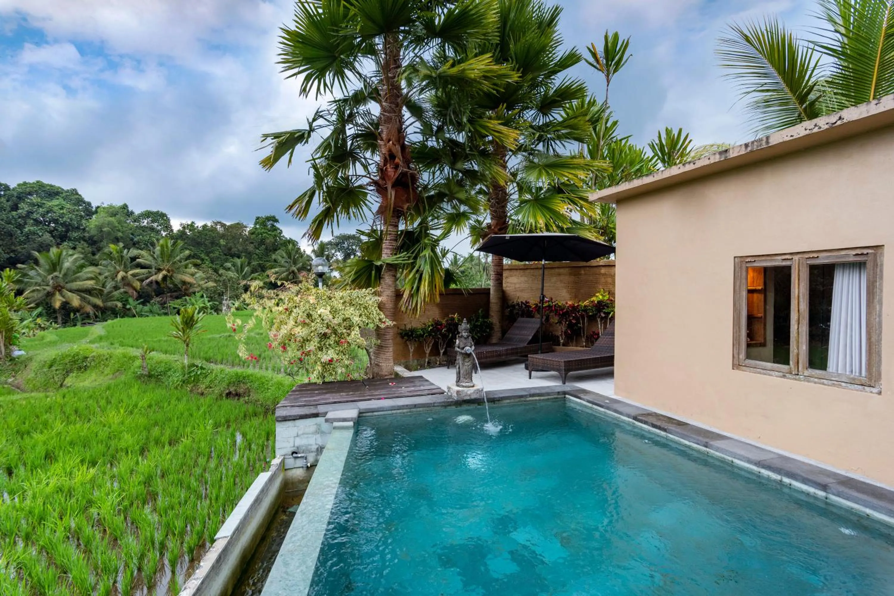 Pool view in Taksu Sebatu Villa by Dhananjaya Hospitality