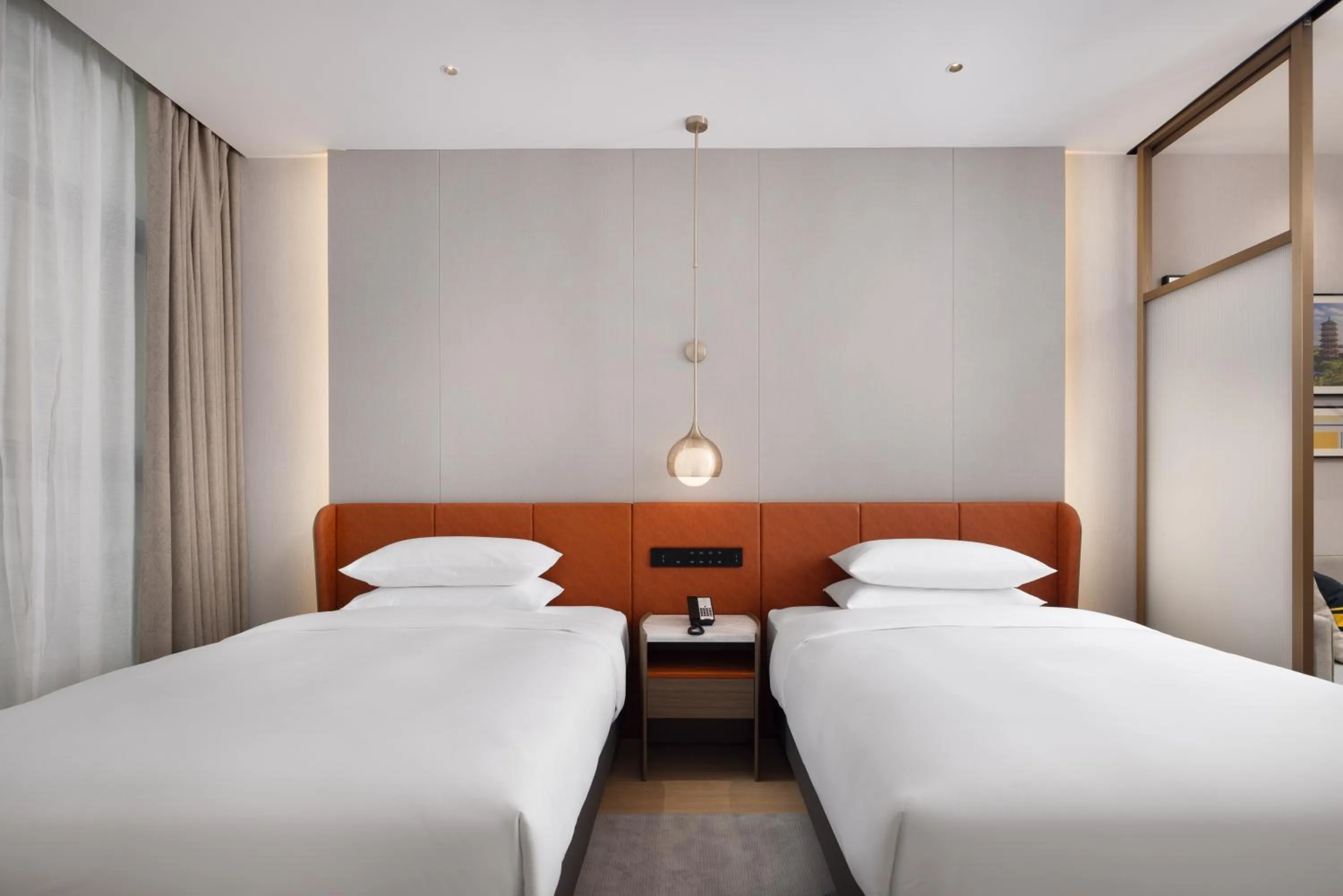 Bed in Home2 Suite by Hilton Dongguan Shipai