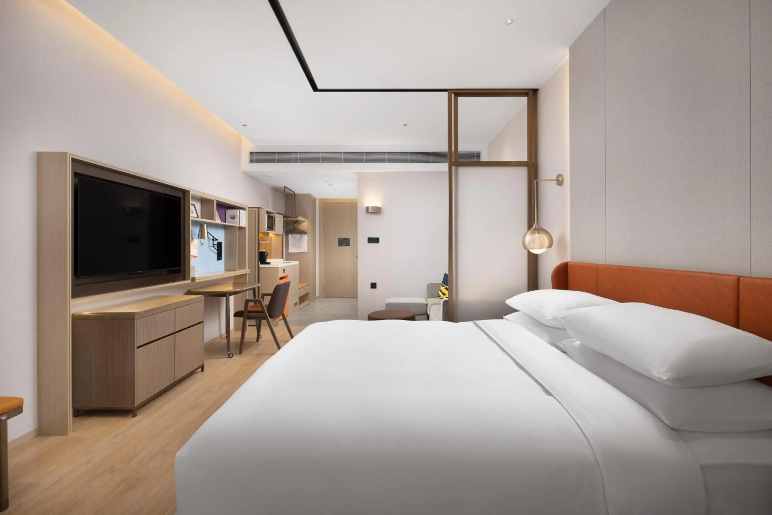 Bed in Home2 Suite by Hilton Dongguan Shipai