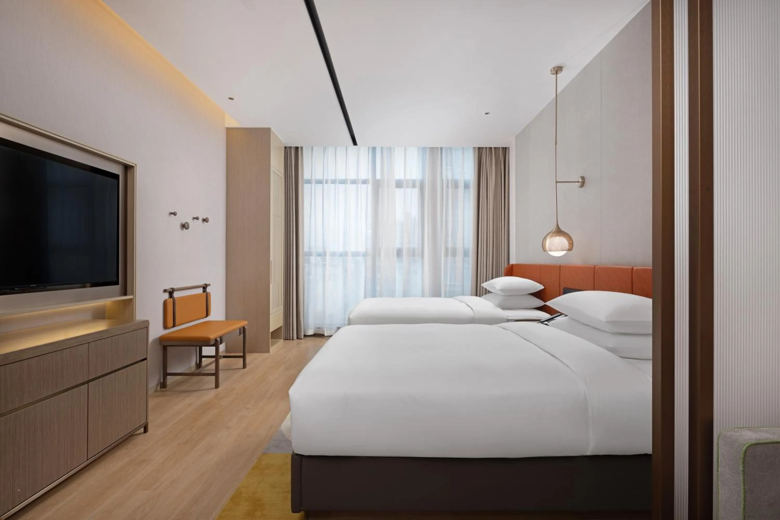 Bed in Home2 Suite by Hilton Dongguan Shipai