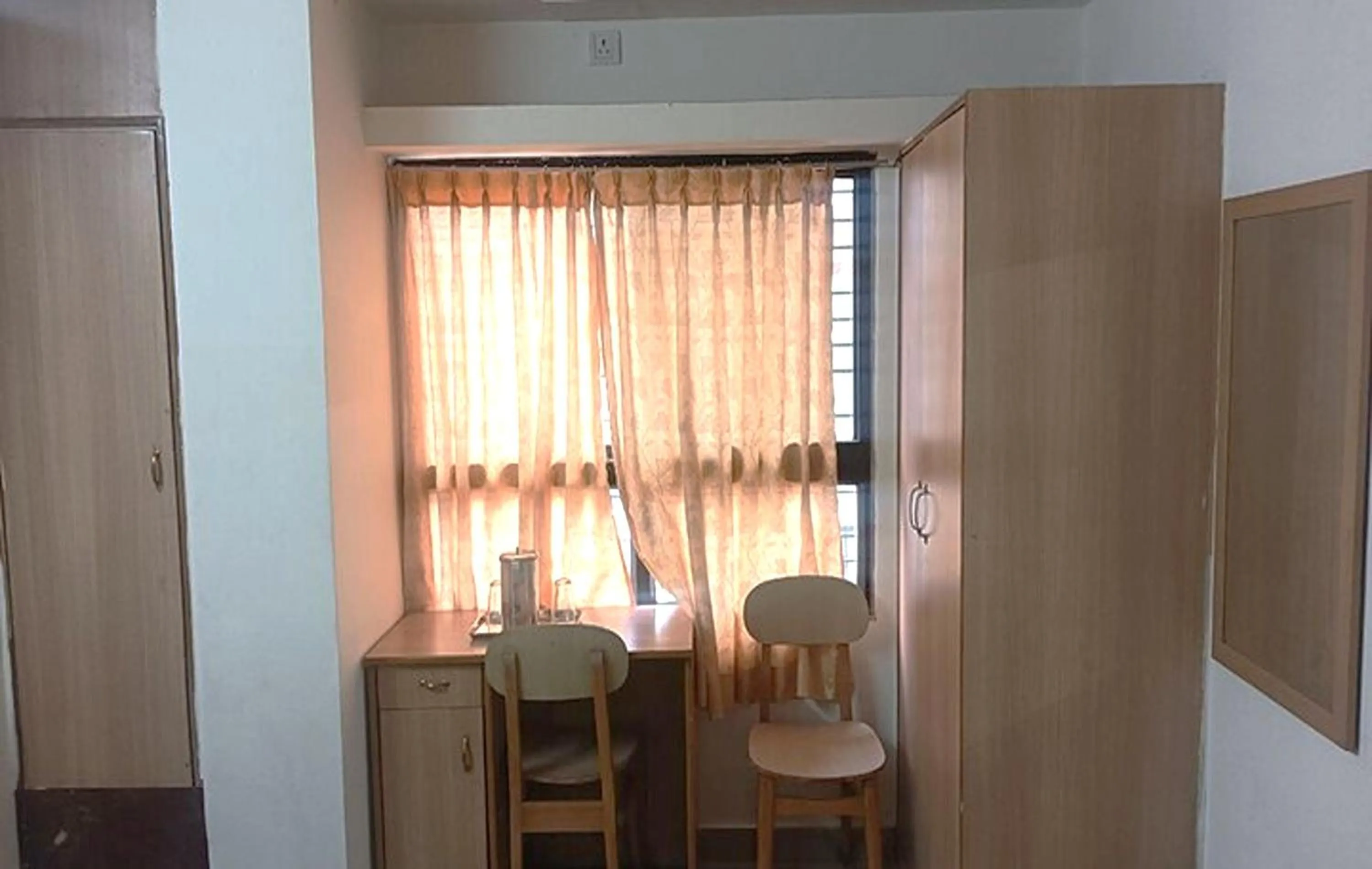 Seating area in Hotel Rainbow near Victoria Hospital City Market