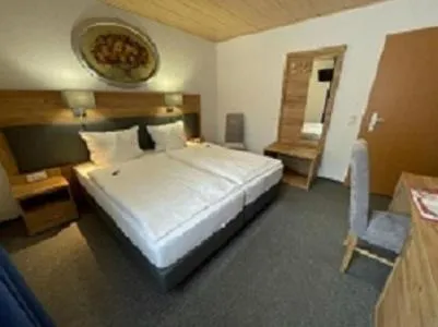 Photo of the whole room, Bed in Pension "Am Brunnen"
