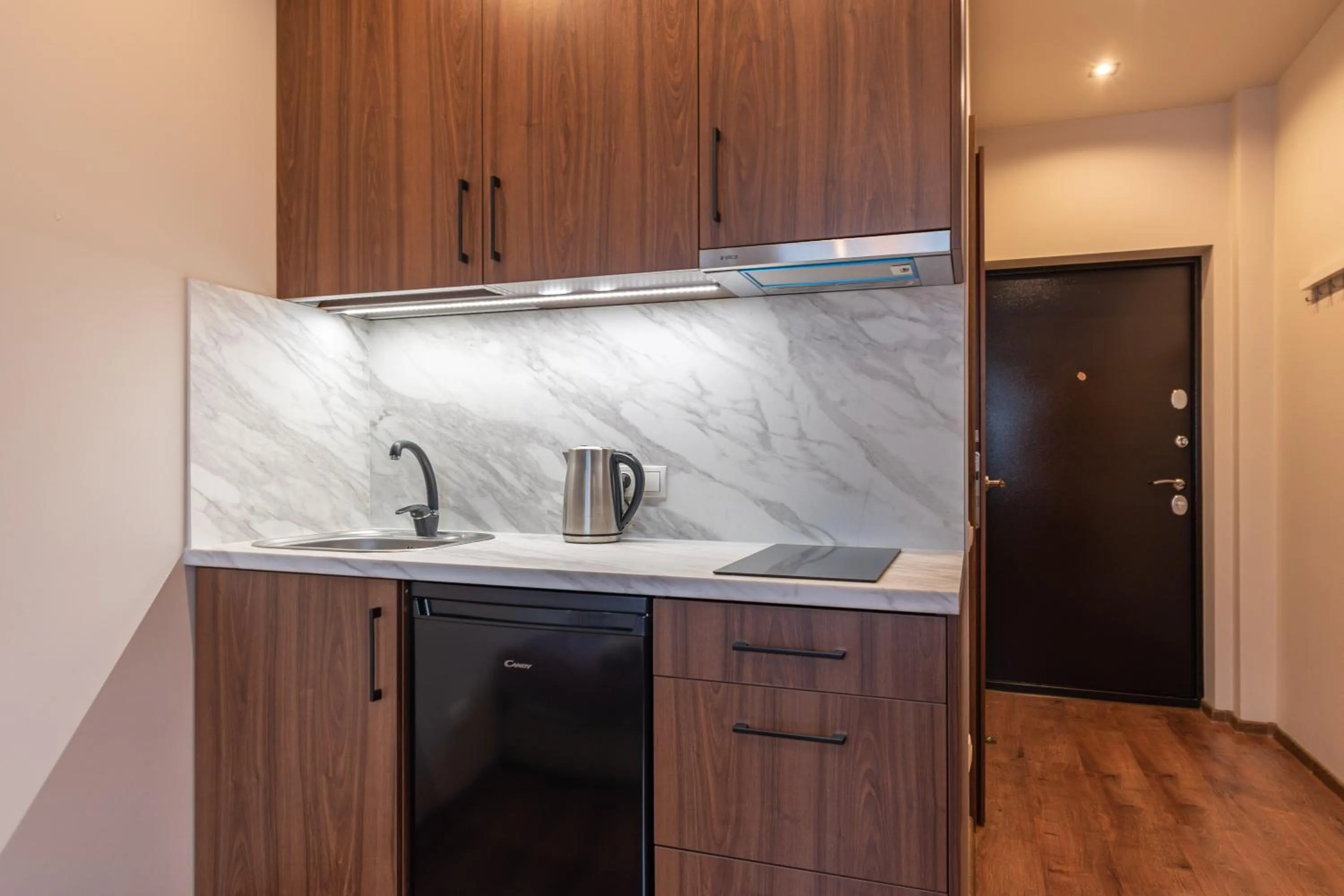 Kitchen or kitchenette in RVR Smart Apartments Riga with Free Parking and Self Check-in