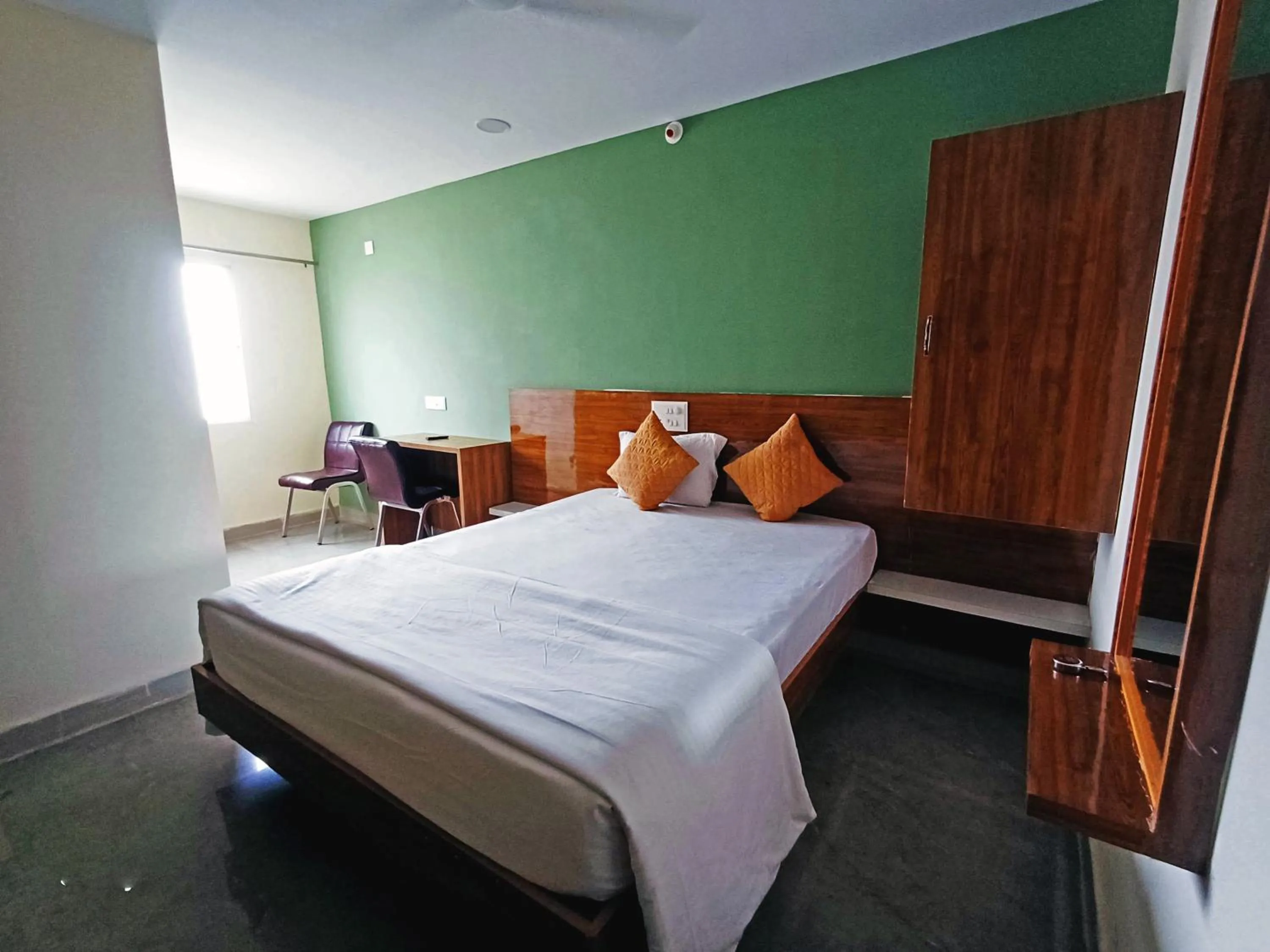 Bedroom in Udupi Deluxe Lodge Gulbarga