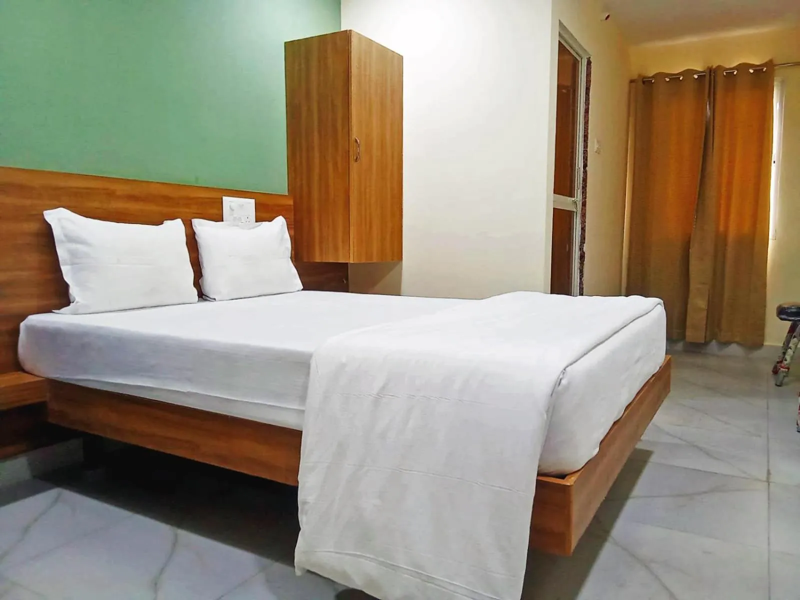 Bedroom in Udupi Deluxe Lodge Gulbarga