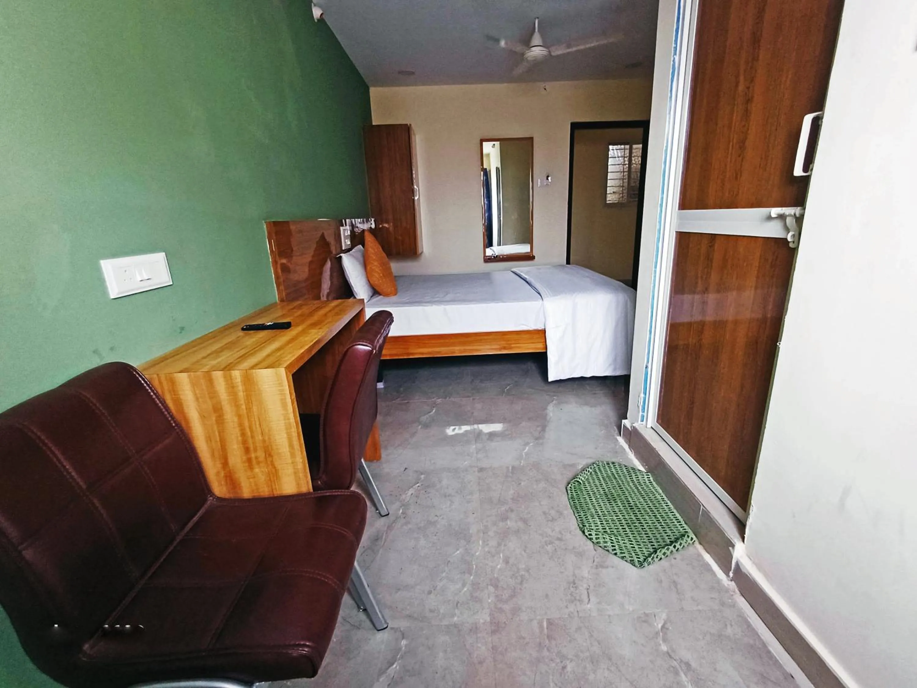 Bedroom in Udupi Deluxe Lodge Gulbarga