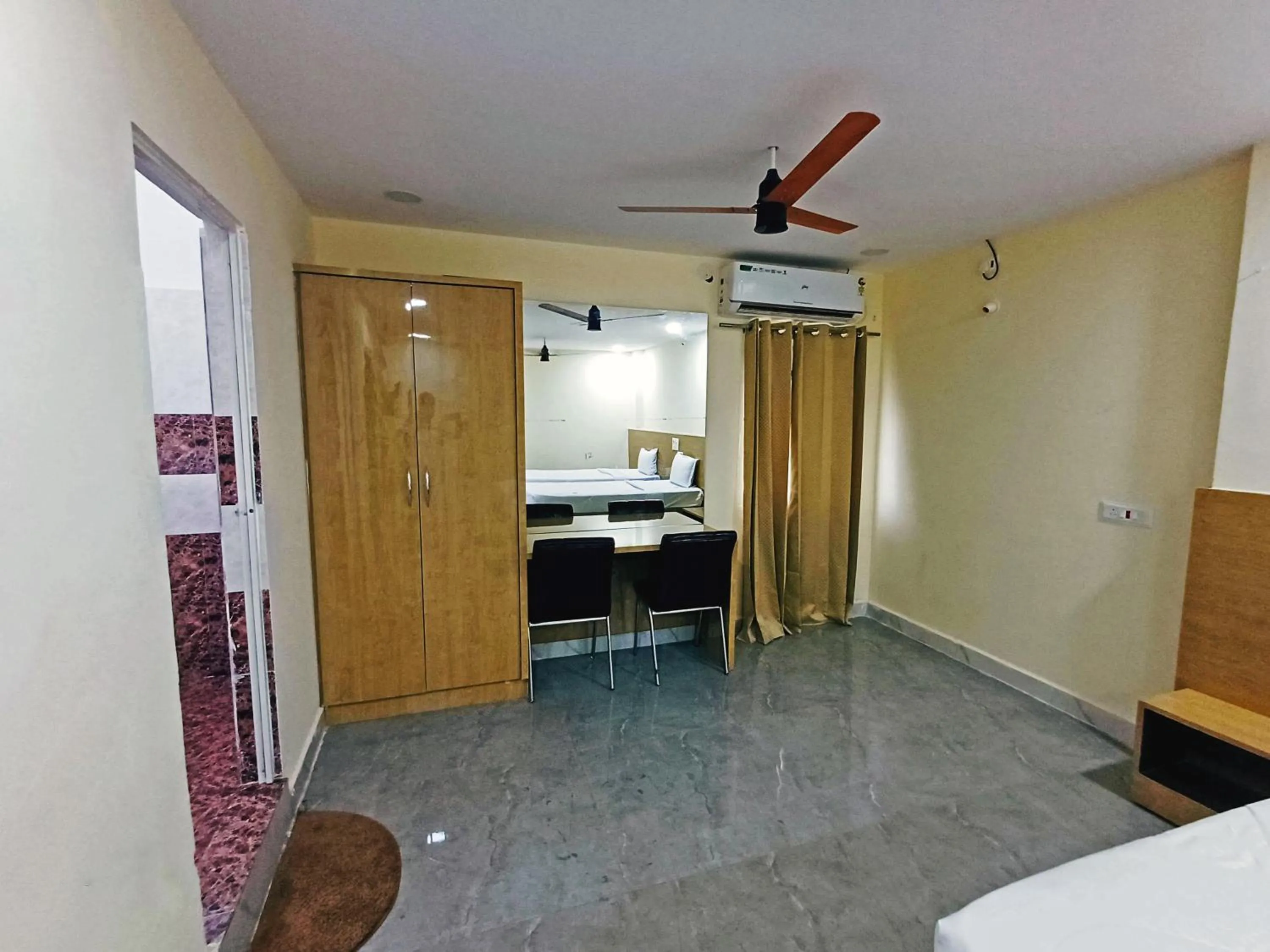 Bedroom in Udupi Deluxe Lodge Gulbarga