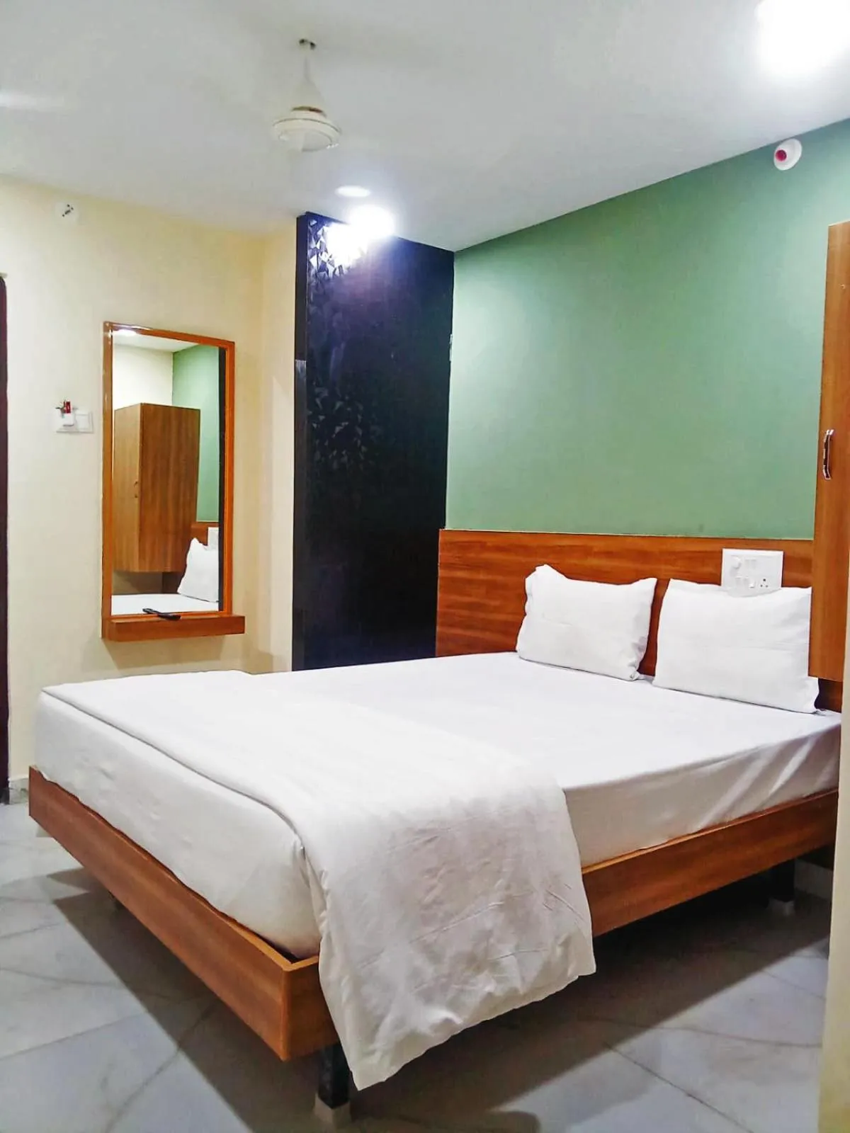 Bedroom in Udupi Deluxe Lodge Gulbarga