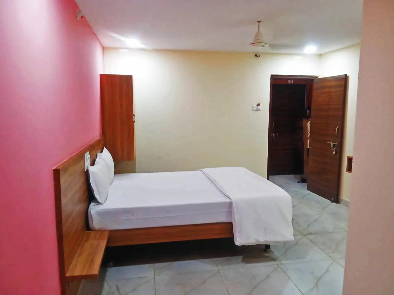 Bedroom in Udupi Deluxe Lodge Gulbarga