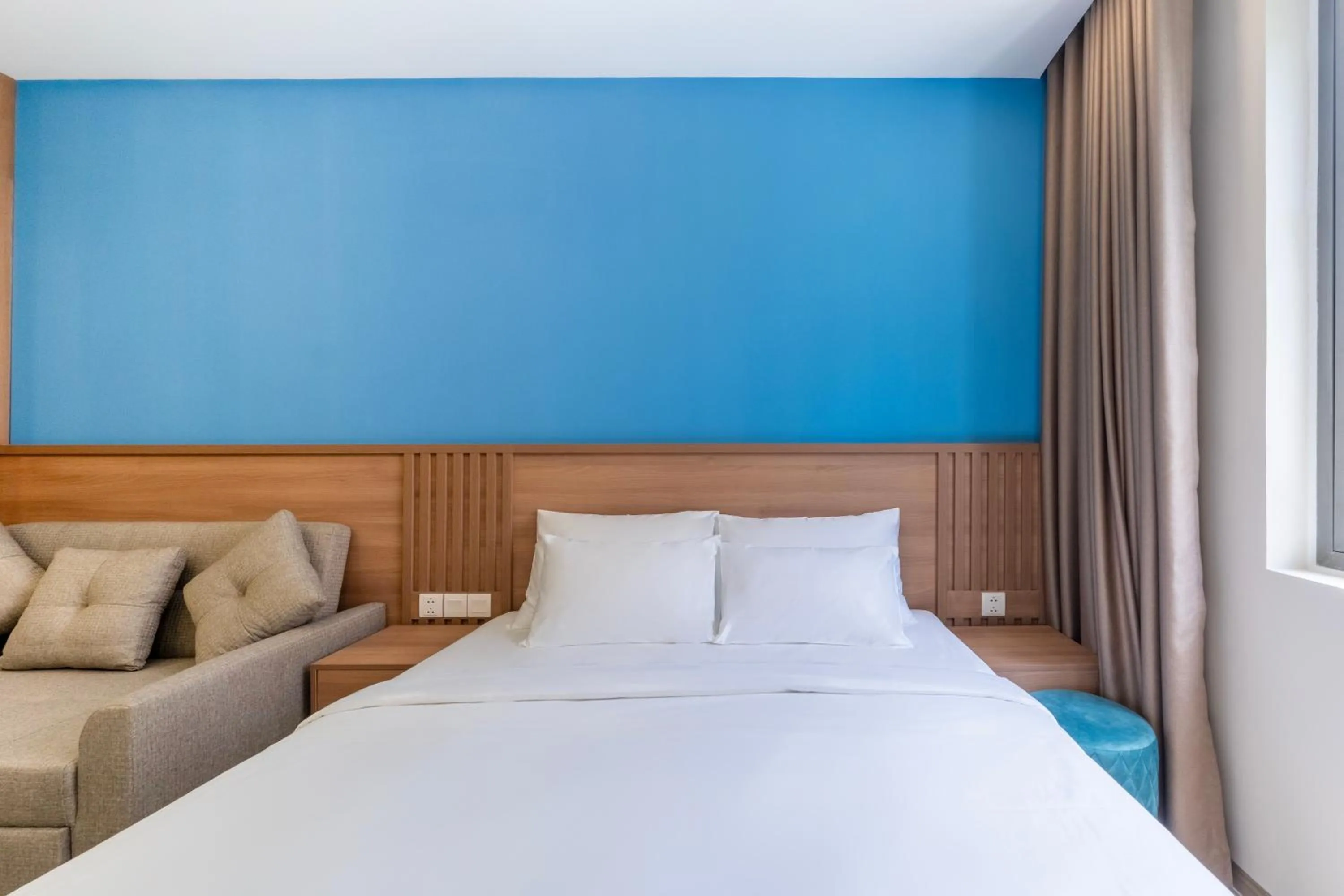 Bed in HL Melody Boutique Hotel