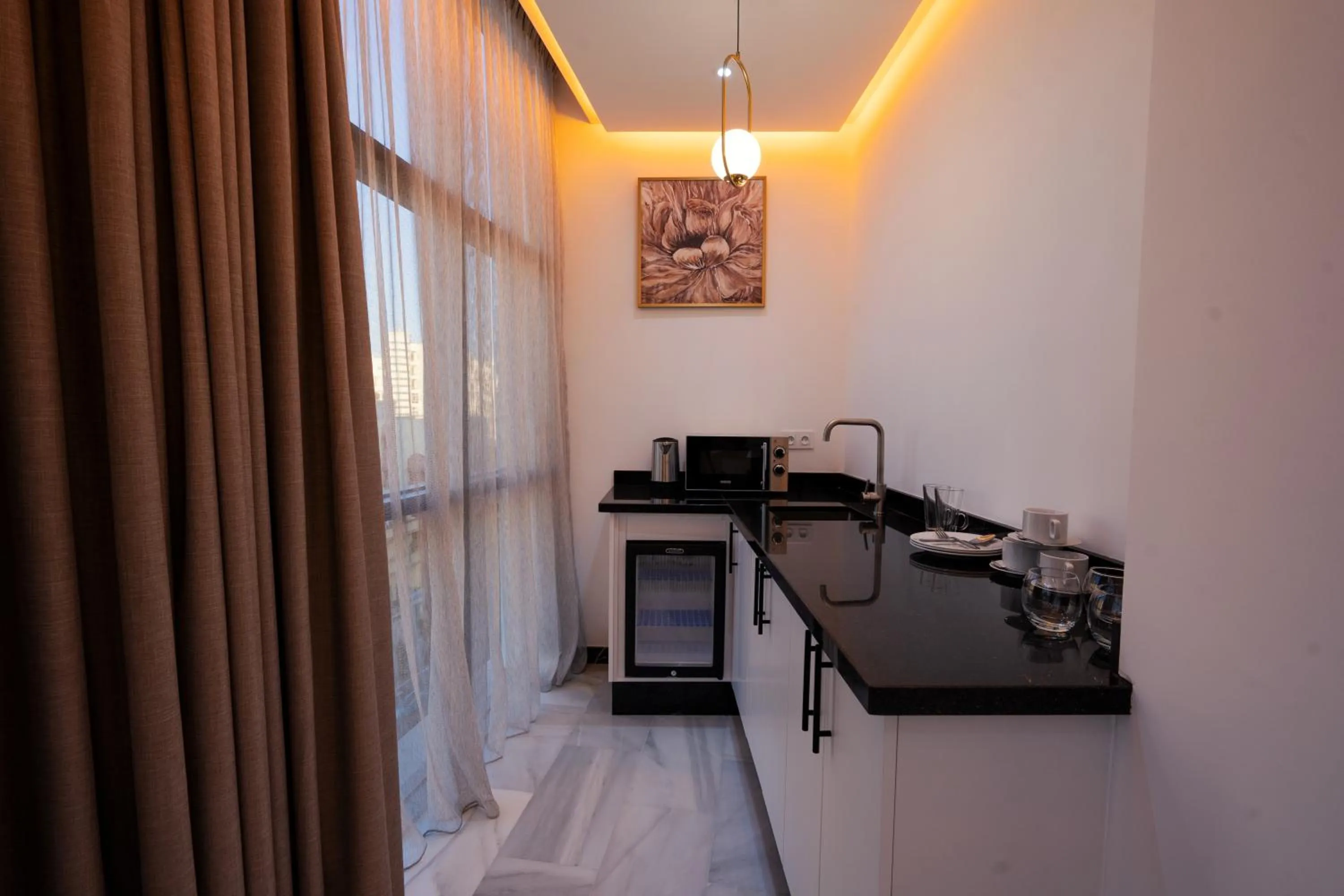 Kitchen or kitchenette in IMMOKA SUITEs