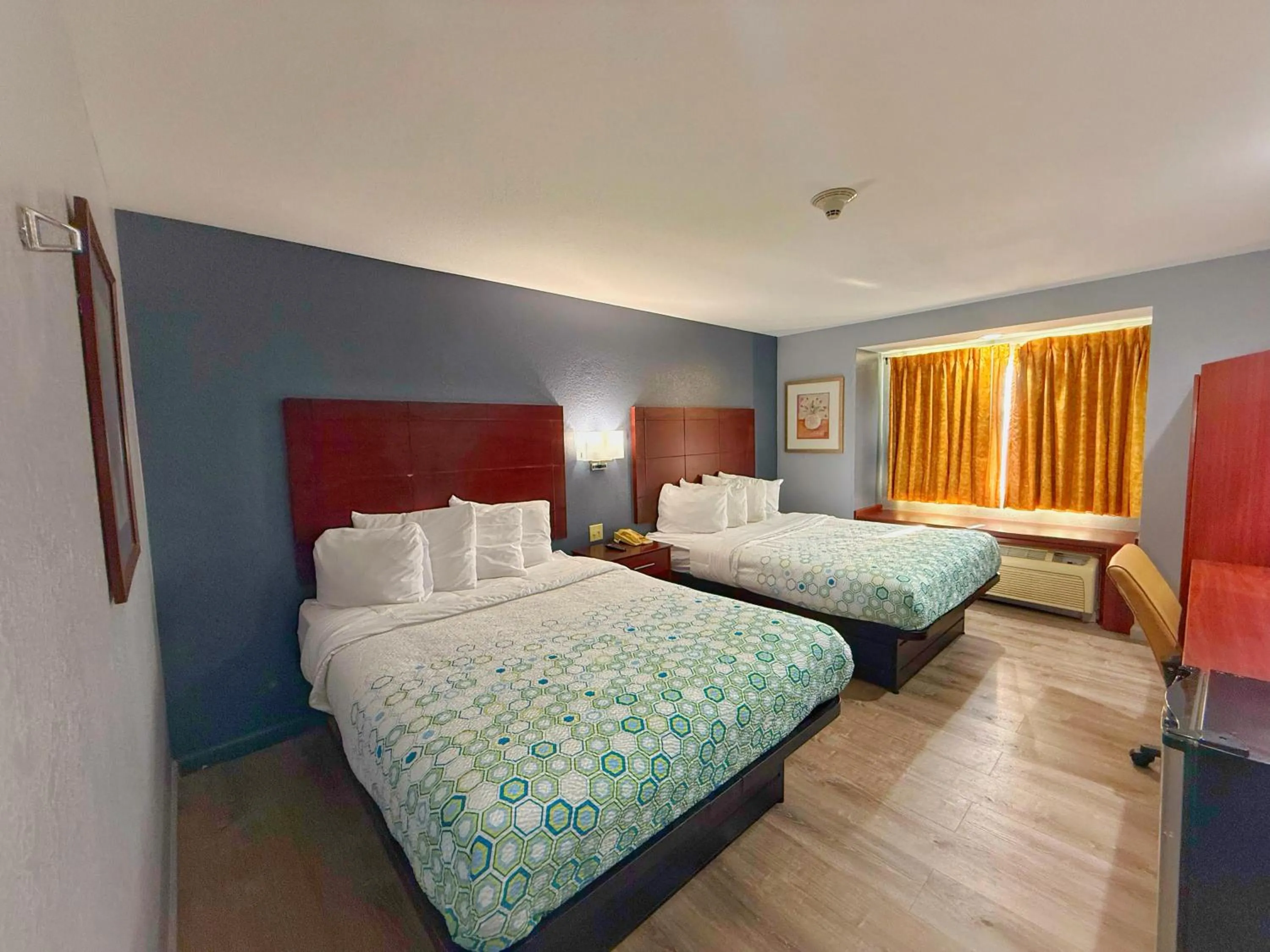 Bed in BlissPoint Inn & Suites, Northwood