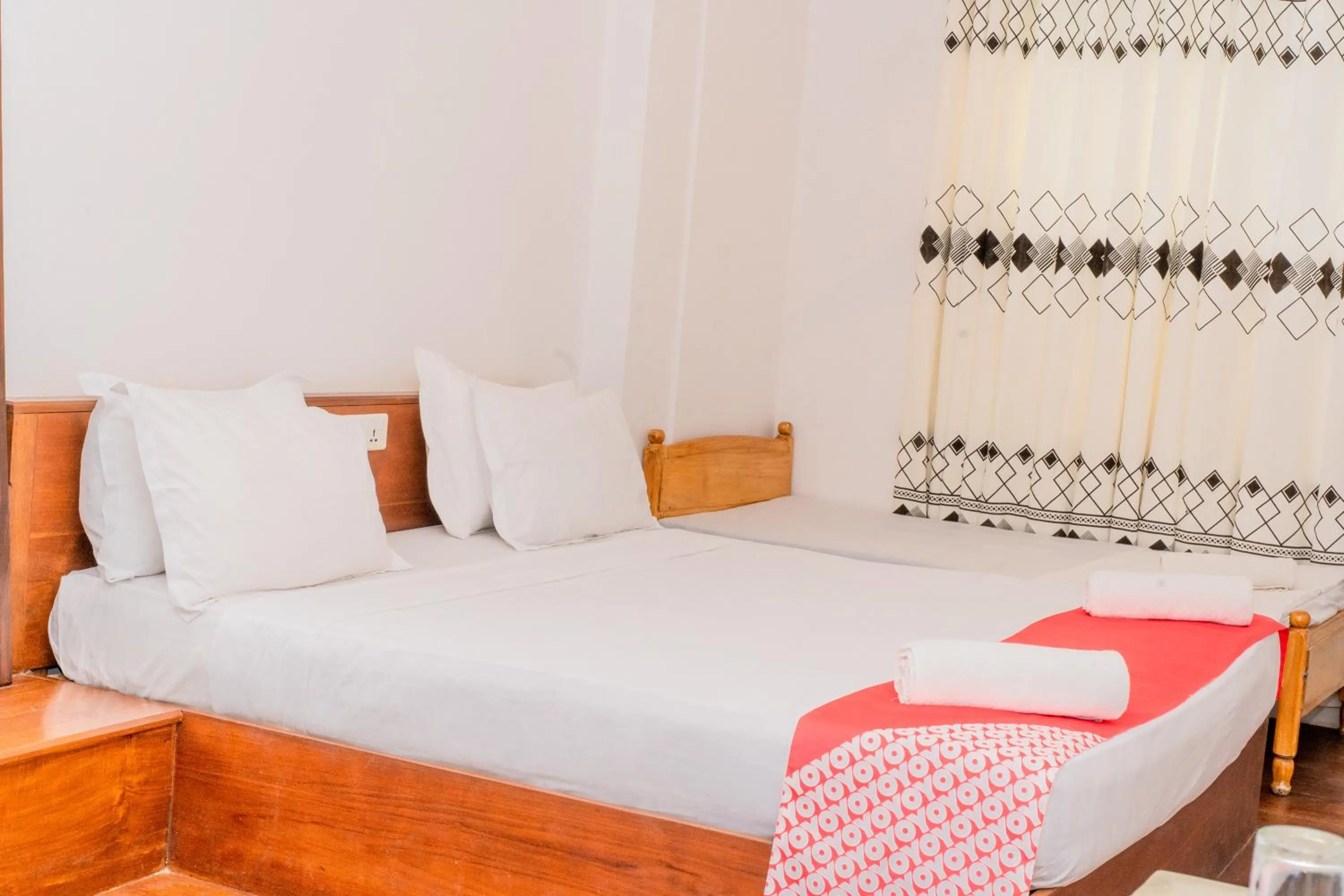 Bed in New Wave Beach Resort Unawatuna