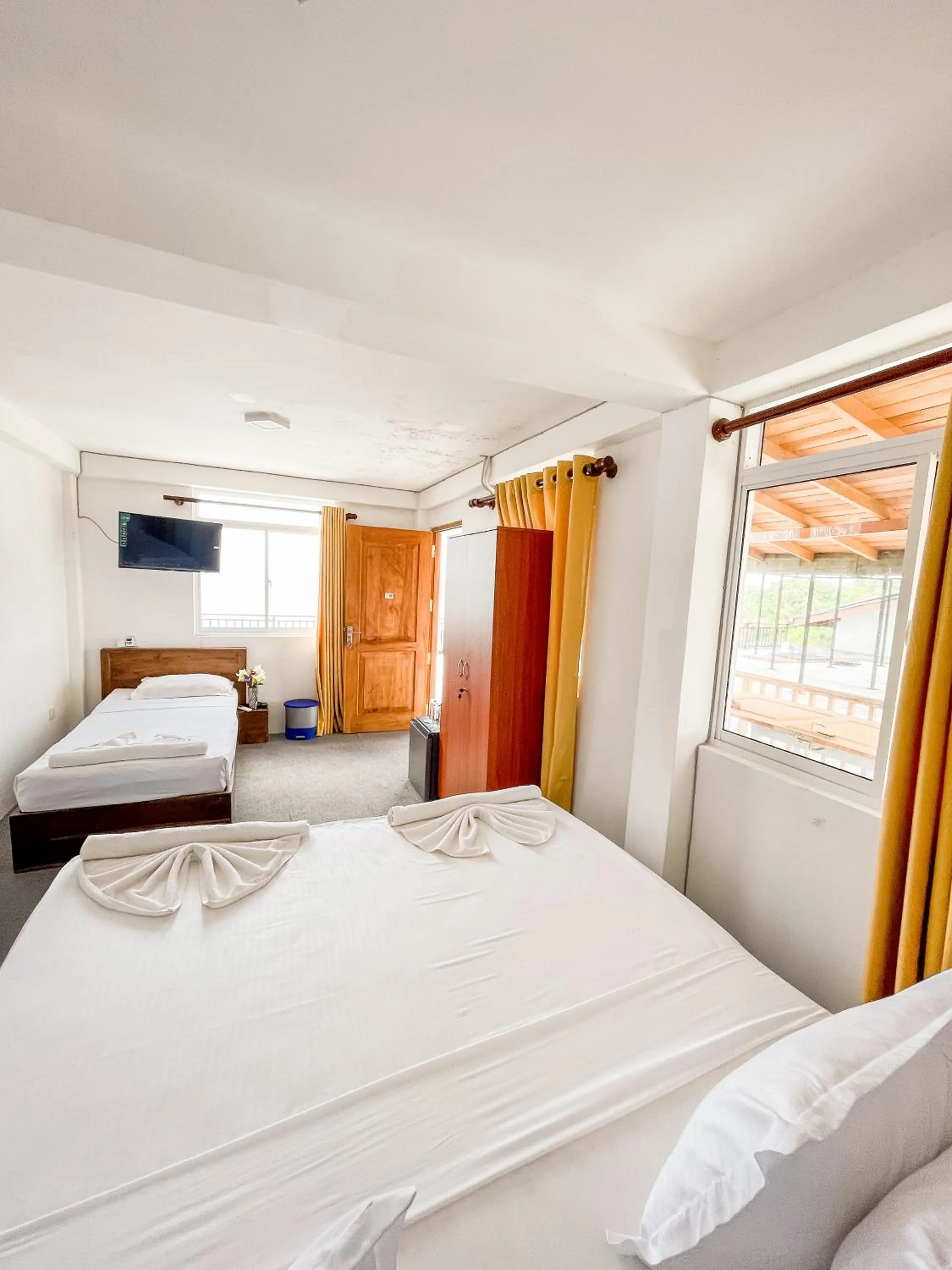 Bed in New Wave Beach Resort Unawatuna