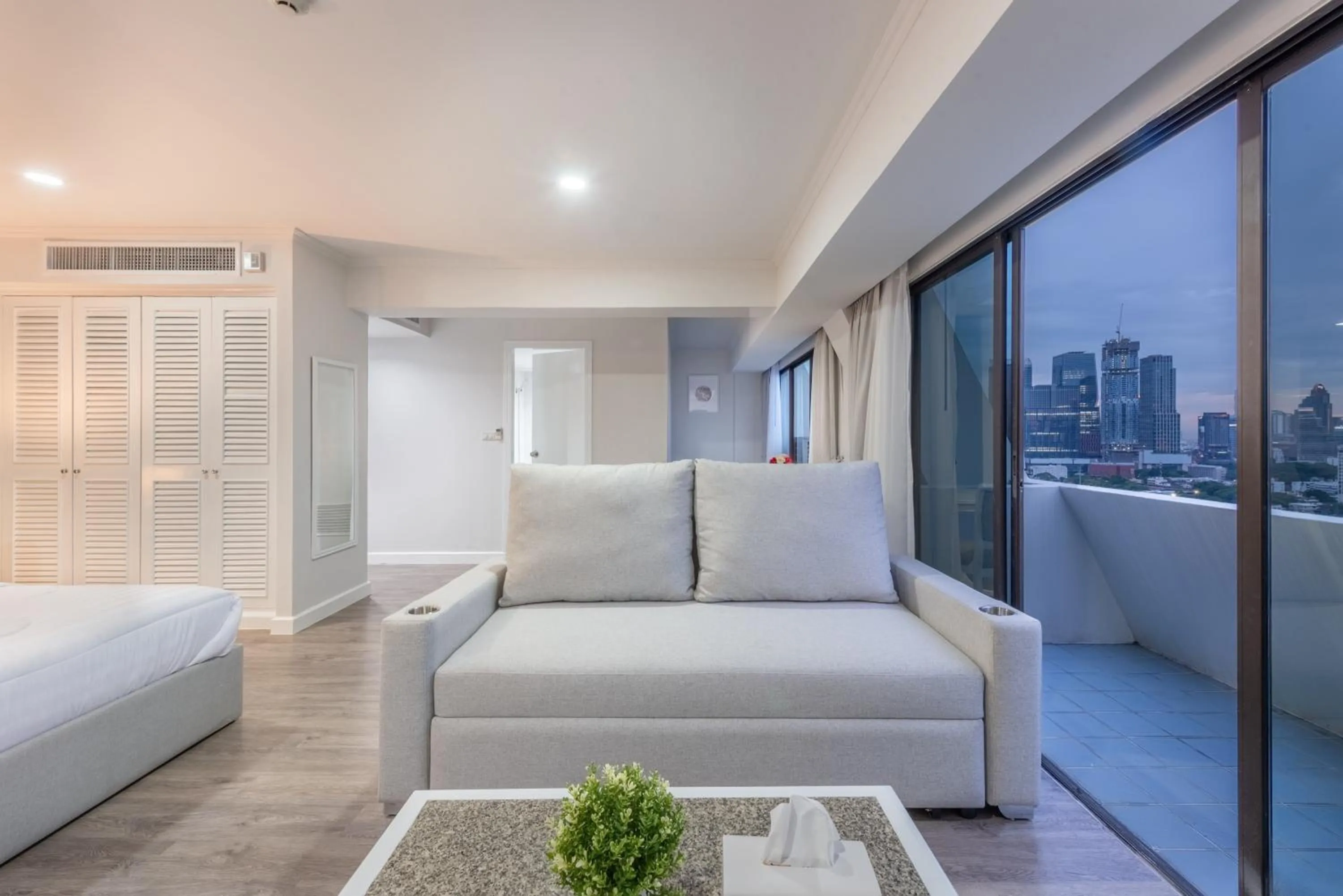 Seating area, Bed in Neom Town Residence