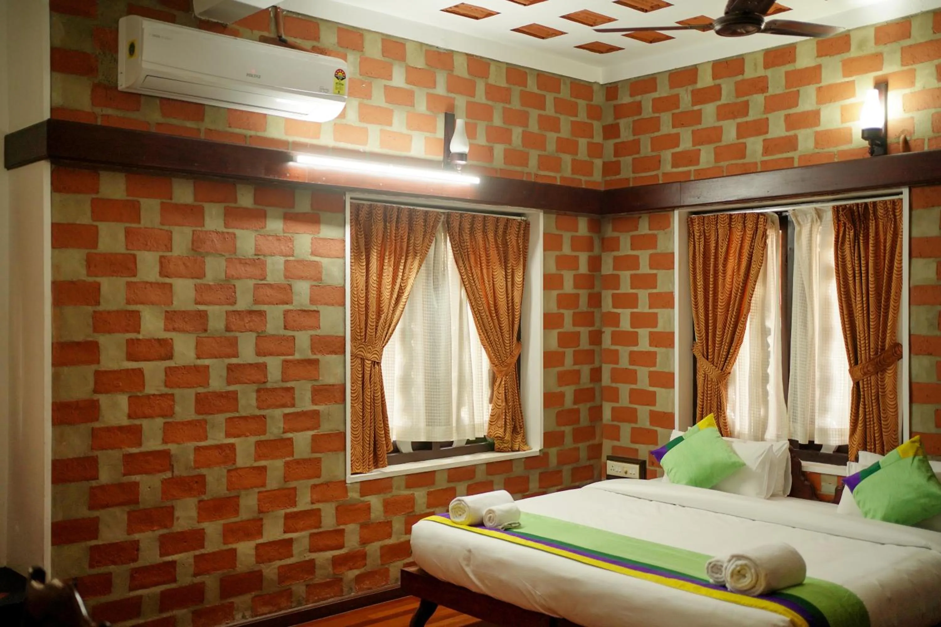 Photo of the whole room, Bed in God's Own country Kovalam By Bestinn Leisure