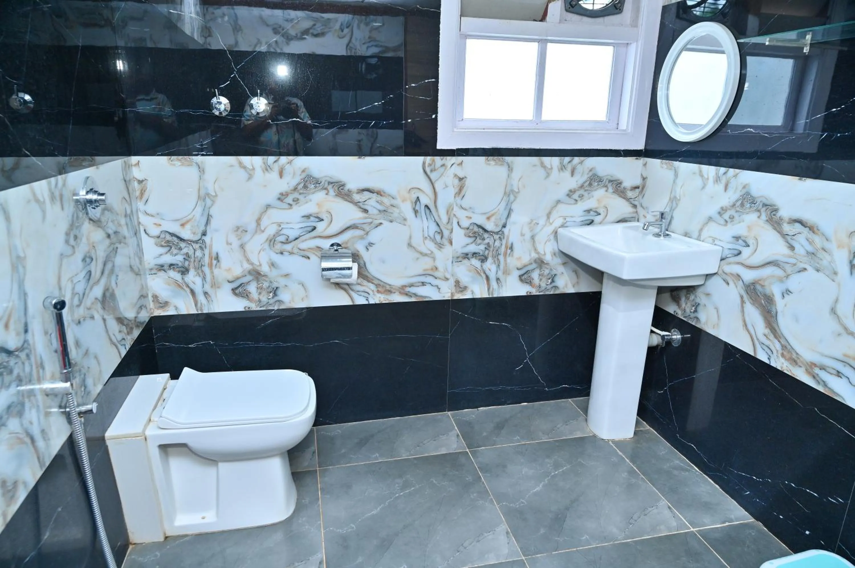 Toilet in NAVARATHNA International resort