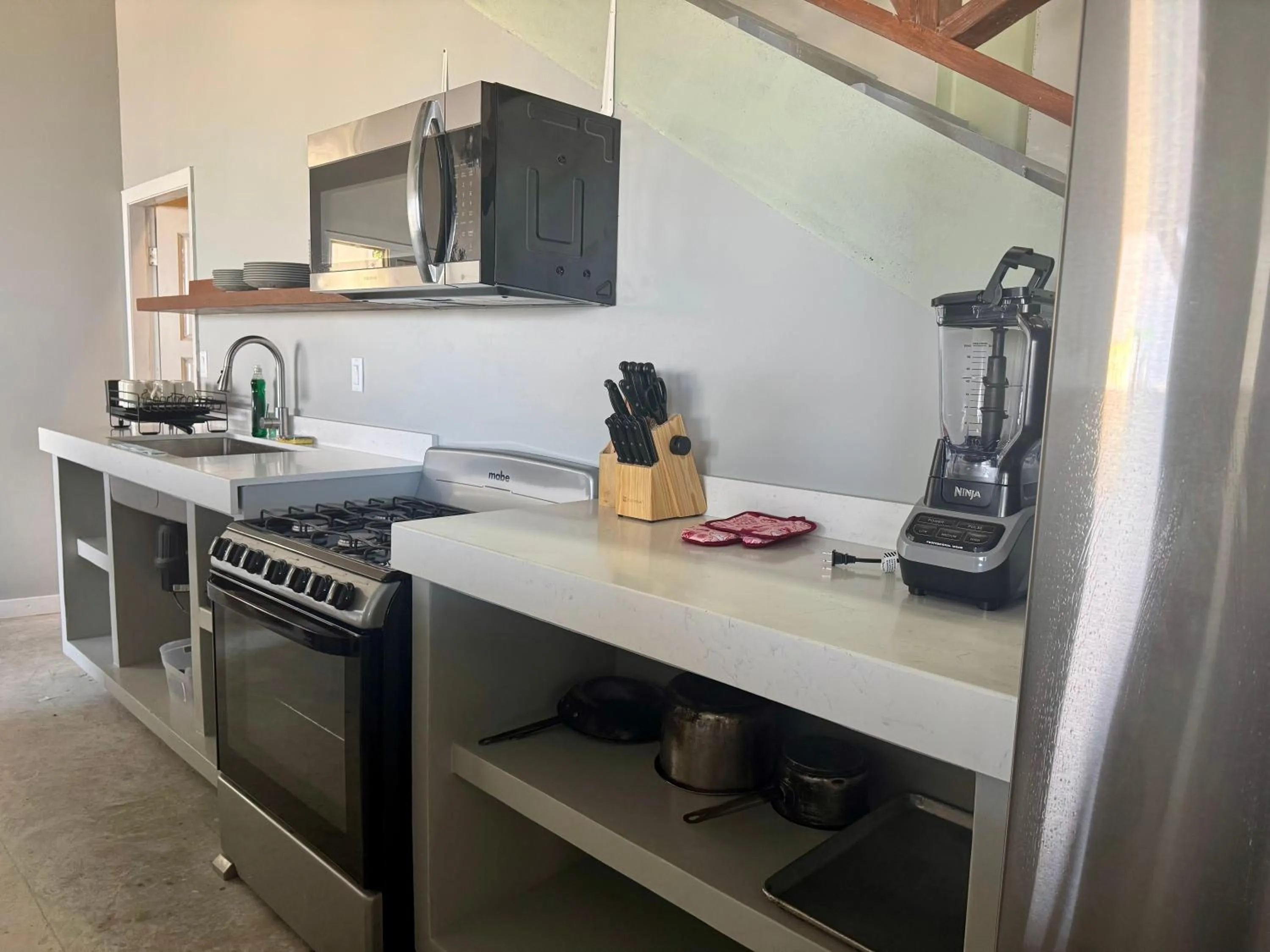 Kitchen or kitchenette in Sandbar Beachfront Hotel & Hostel Restaurant