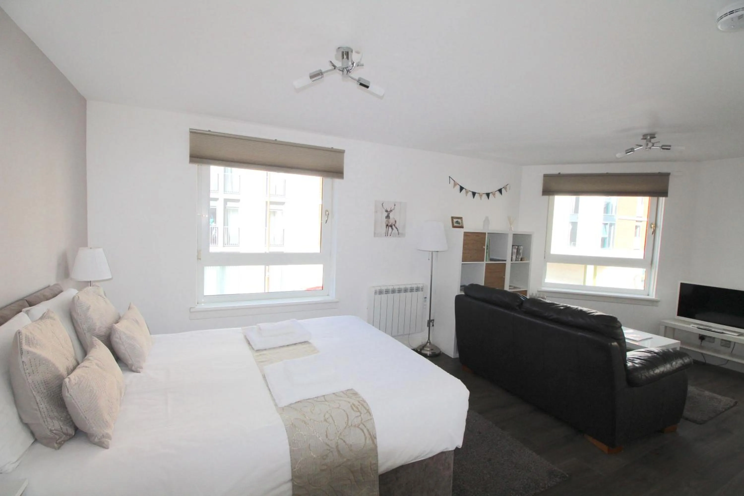 Living room, Bed in Lochrin Apartments by Edinburgh City Apartments