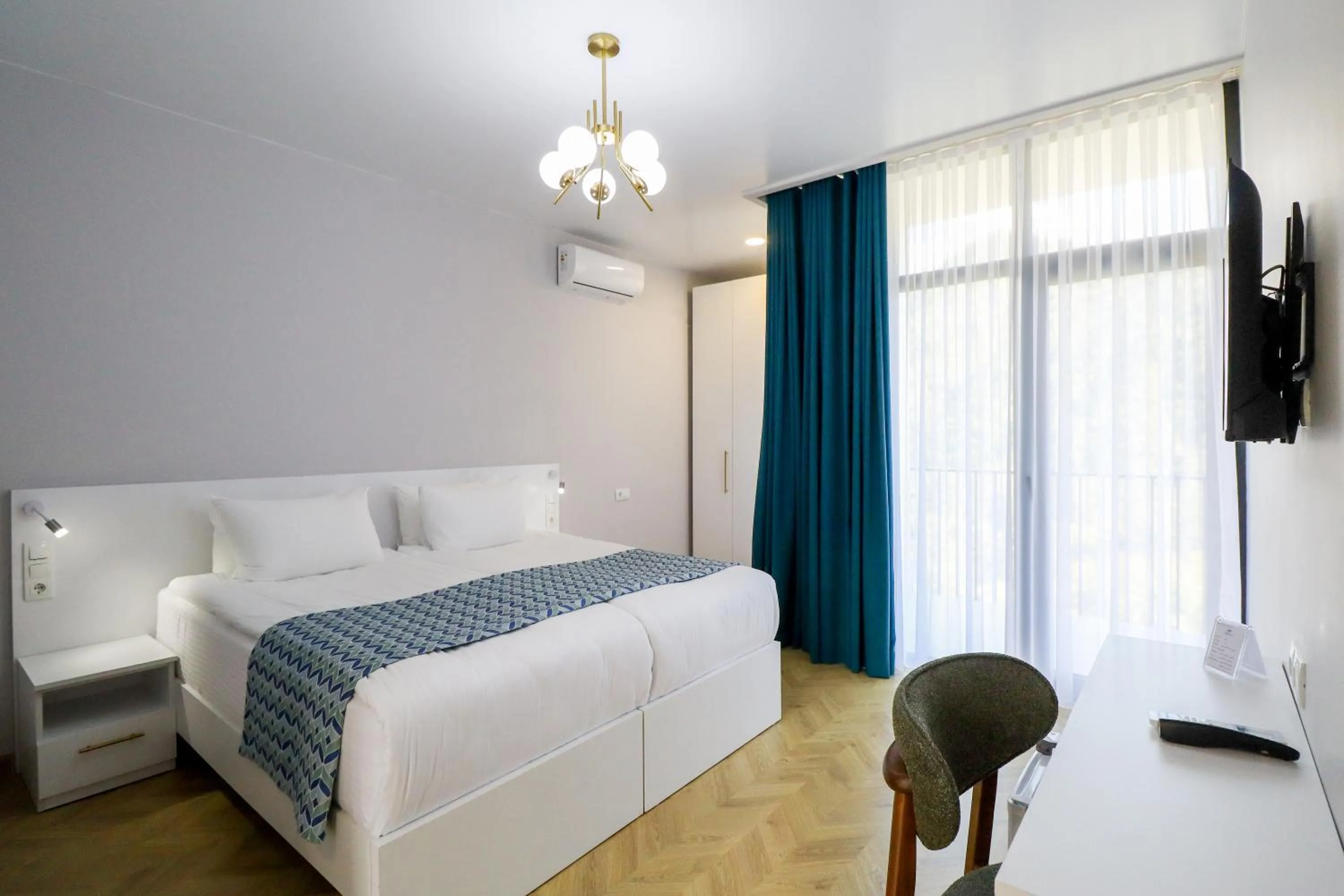 Bed in Emerald Borjomi Hotel