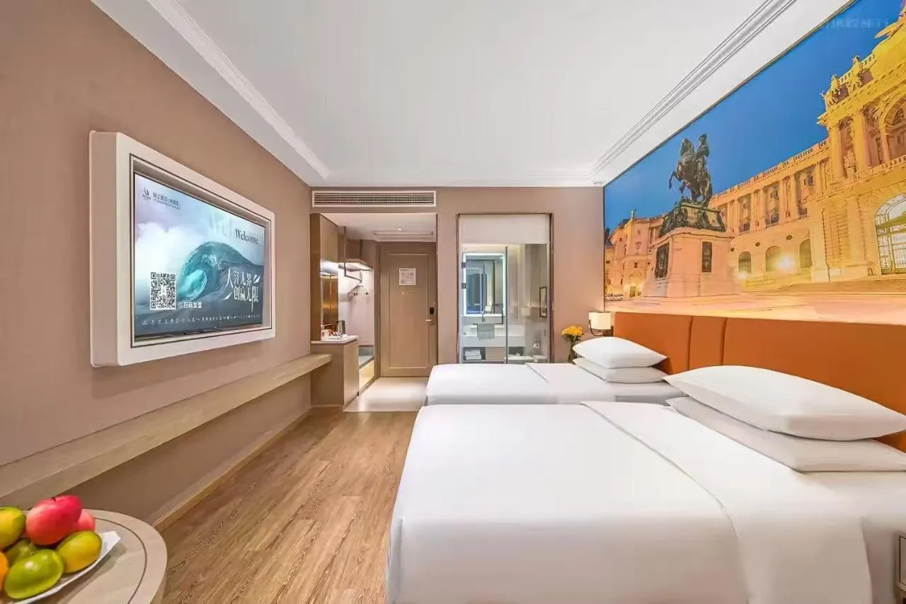 Bed in Vienna Hotel Jiangjin Wanda Plaza Shengquansi Subway Station