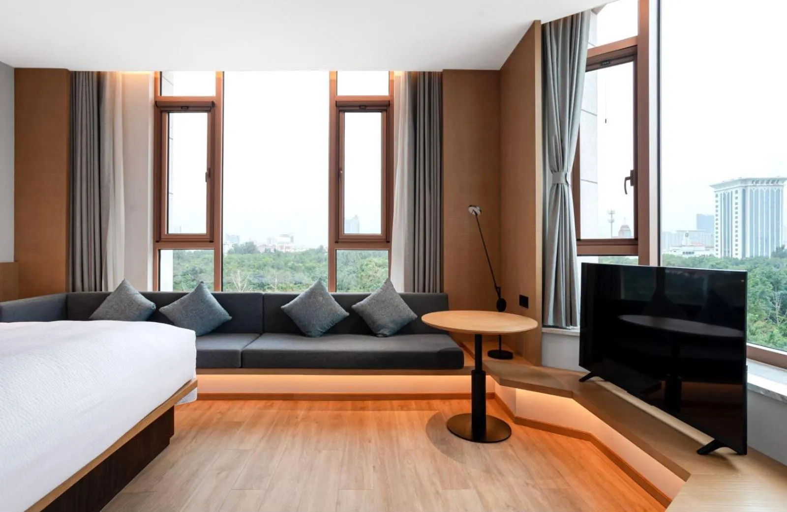 Communal lounge/ TV room, Bed in Fairfield by Marriott Yantai