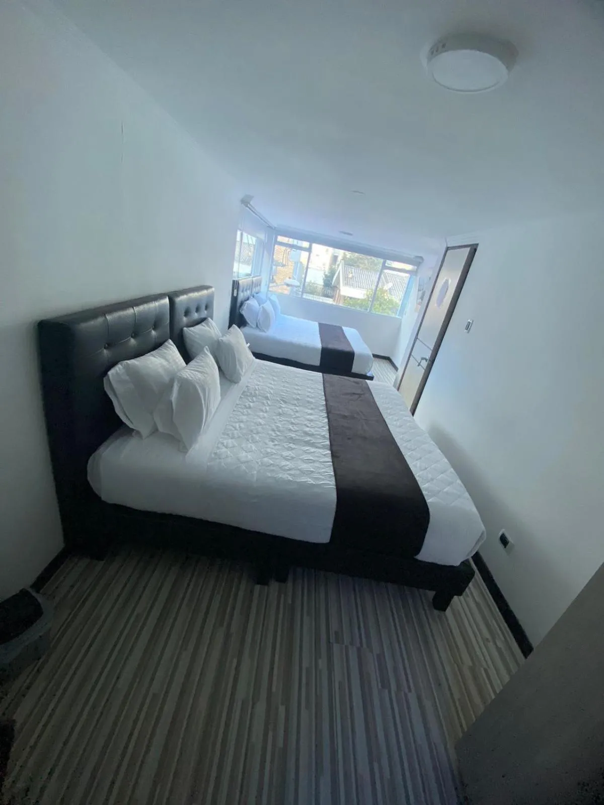 Bed in Hotel AMBAR KING