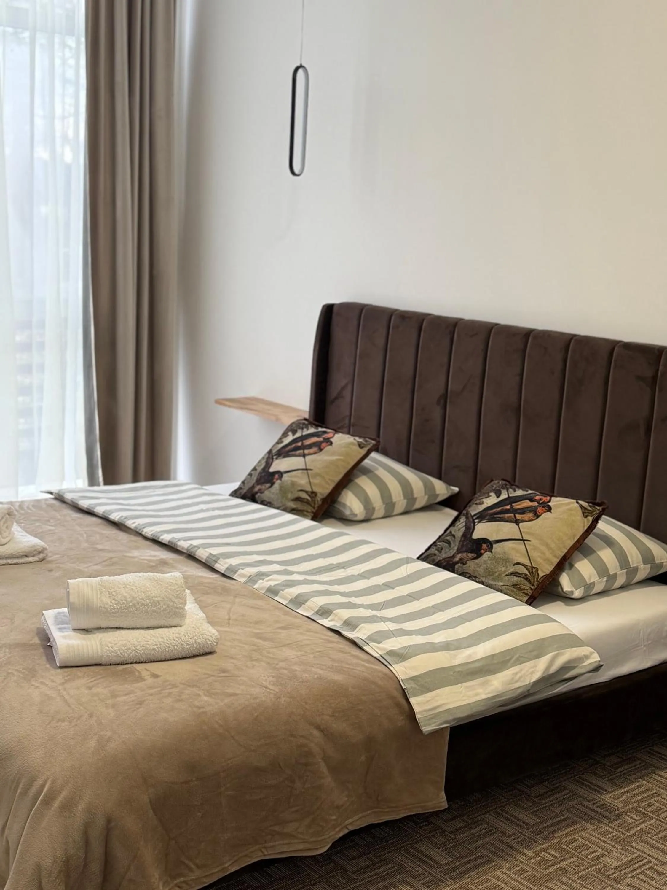 Bed in Muha ApartHotel