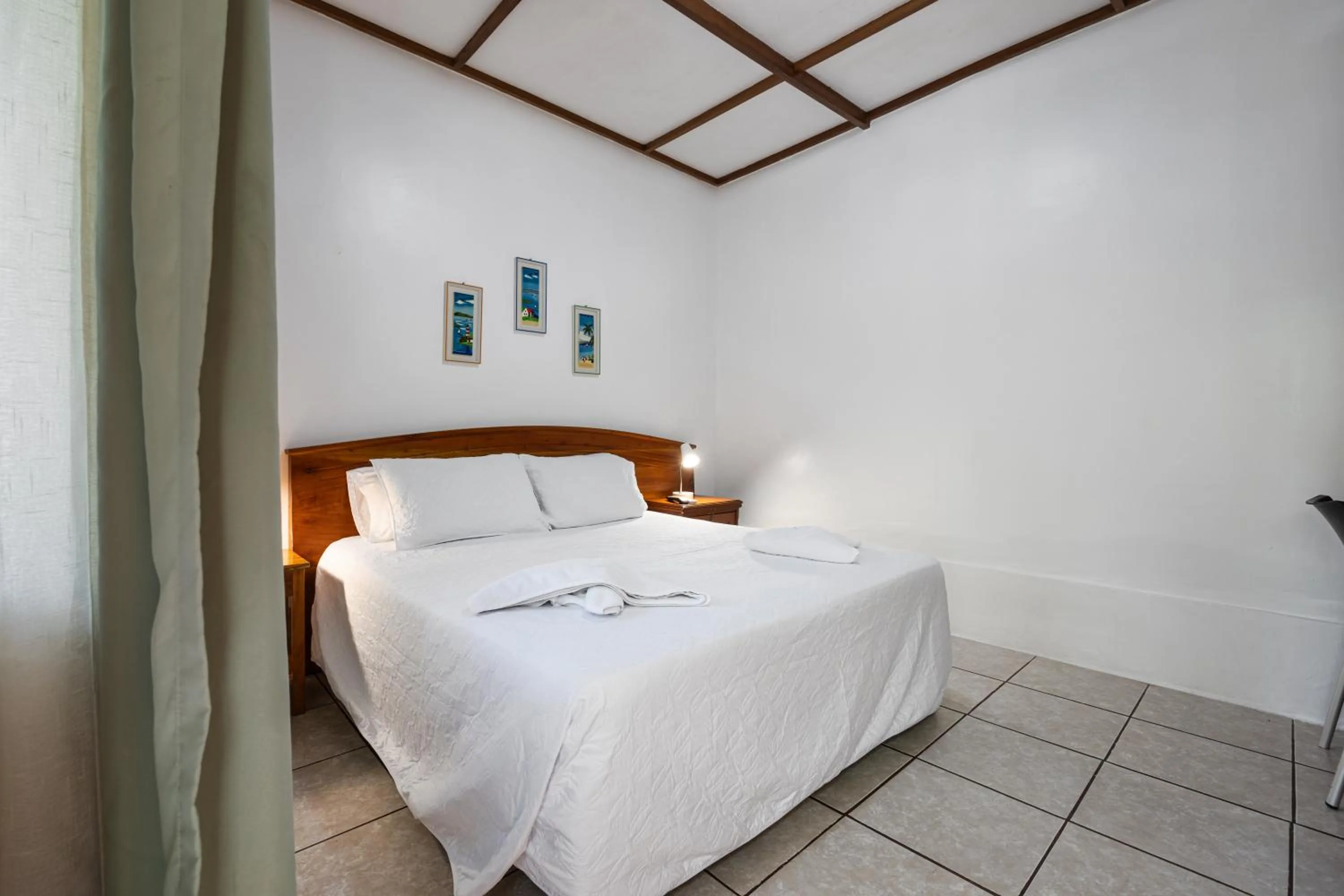 Bed in La Peregrina Galapagos B&B