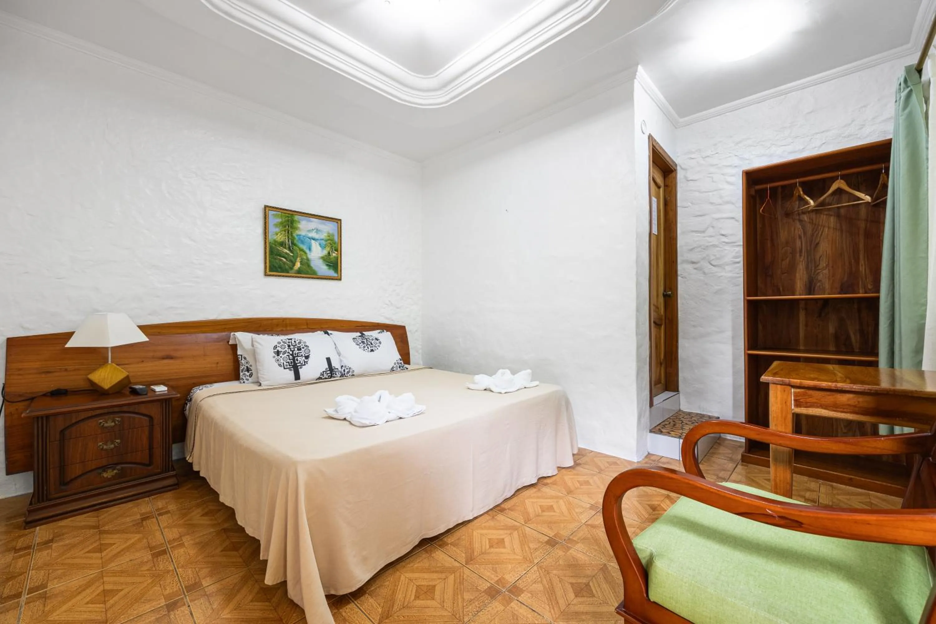 Bed in La Peregrina Galapagos B&B