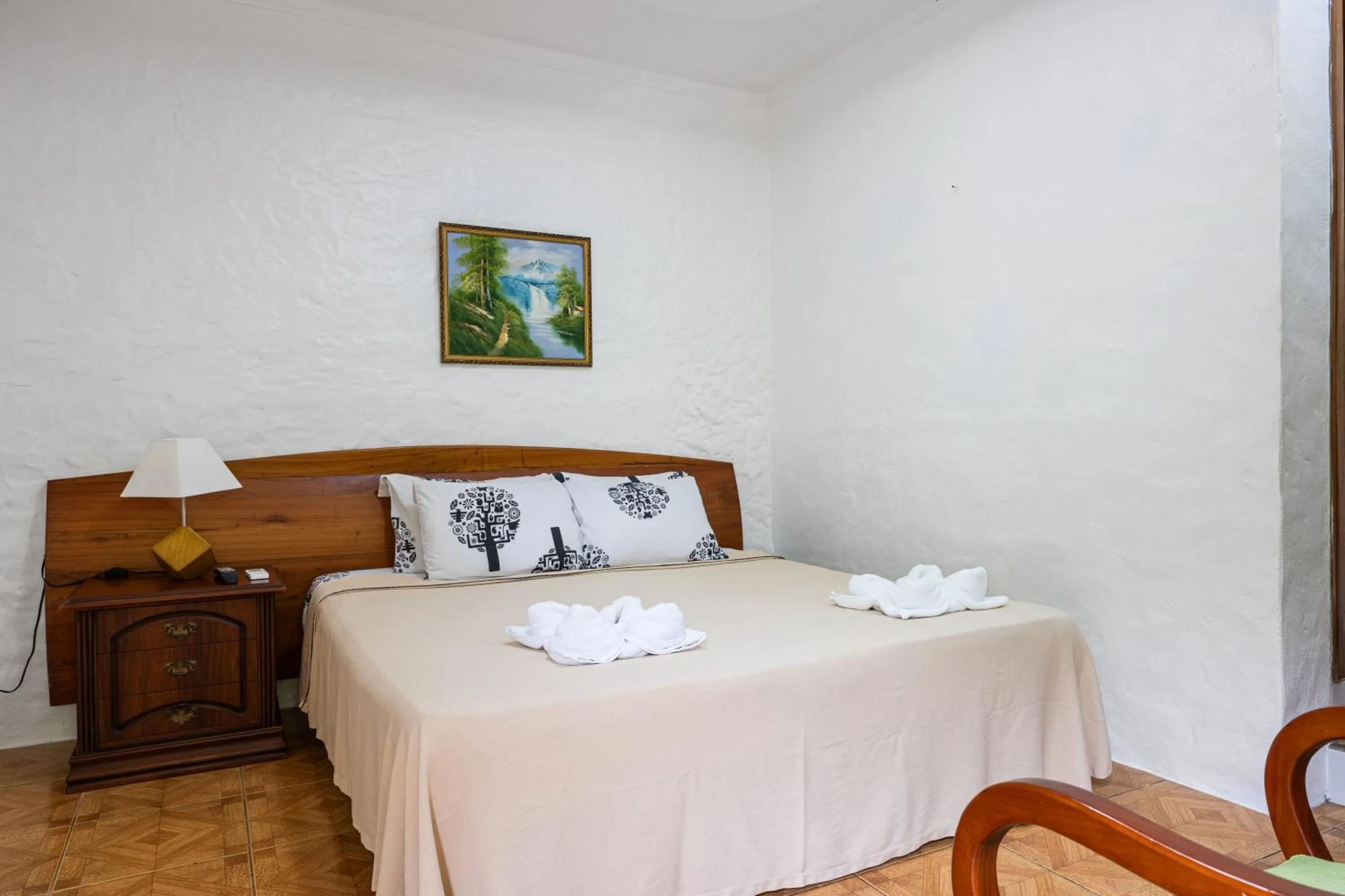 Bed in La Peregrina Galapagos B&B