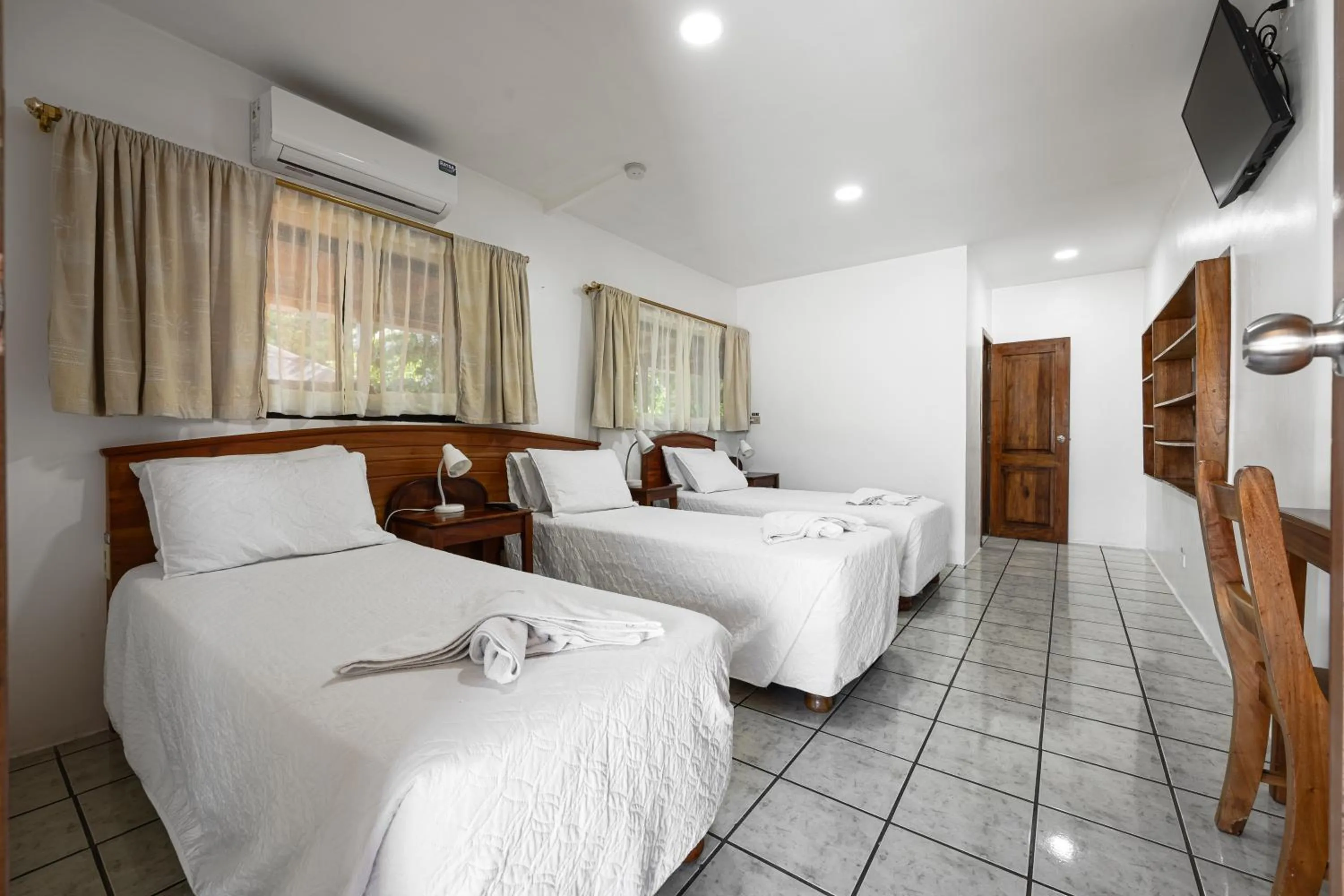 Bed in La Peregrina Galapagos B&B