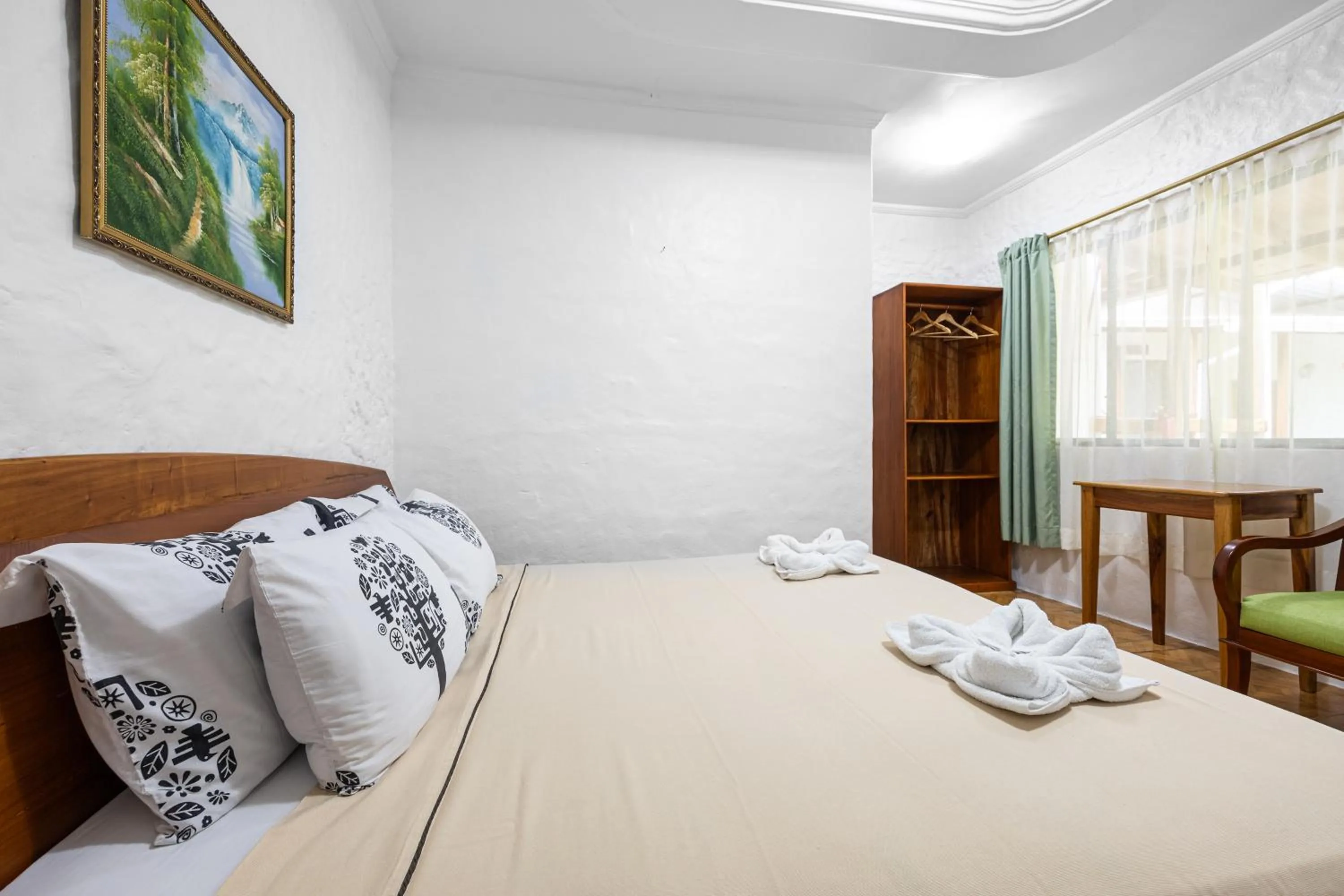 Bed in La Peregrina Galapagos B&B