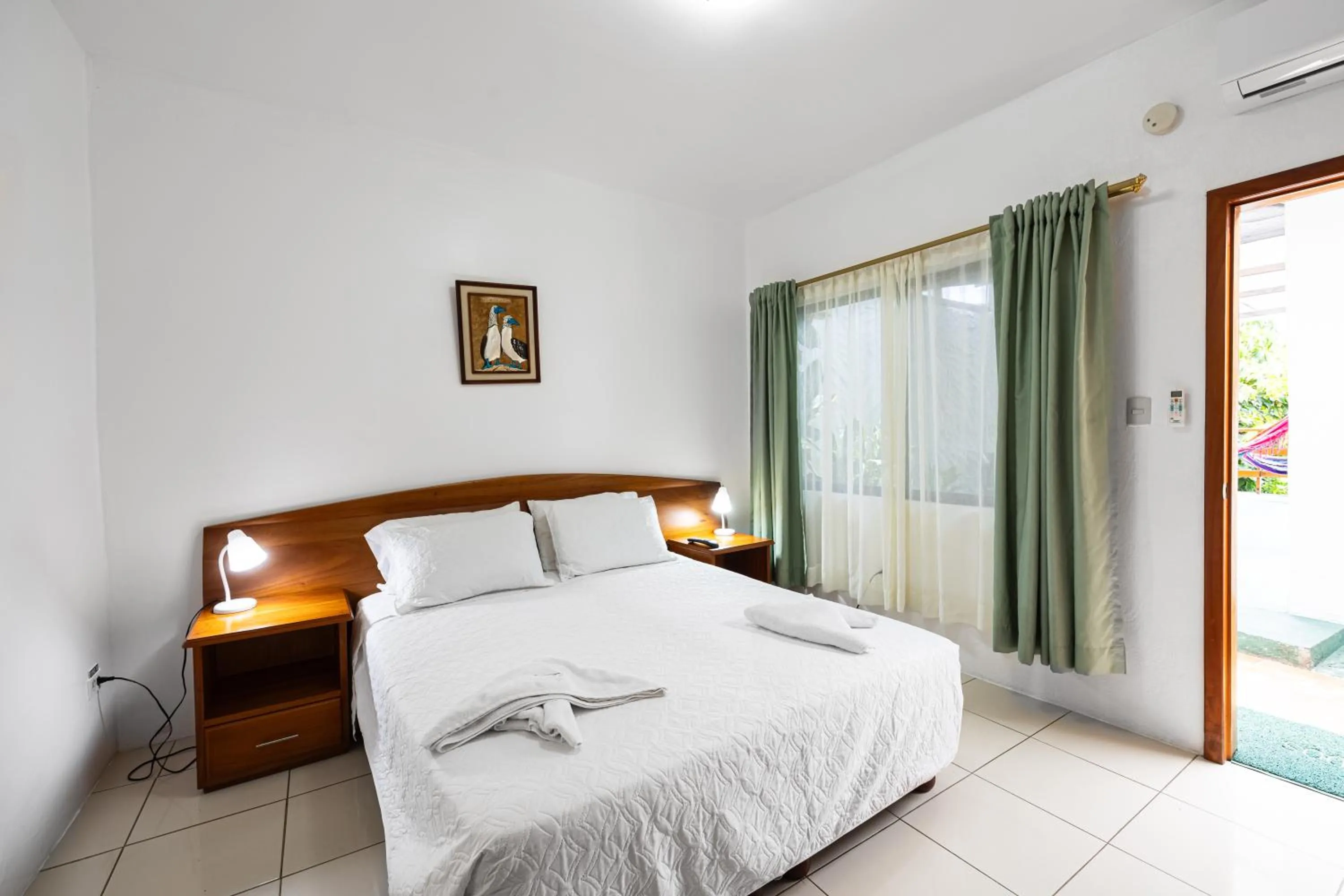 Bed in La Peregrina Galapagos B&B