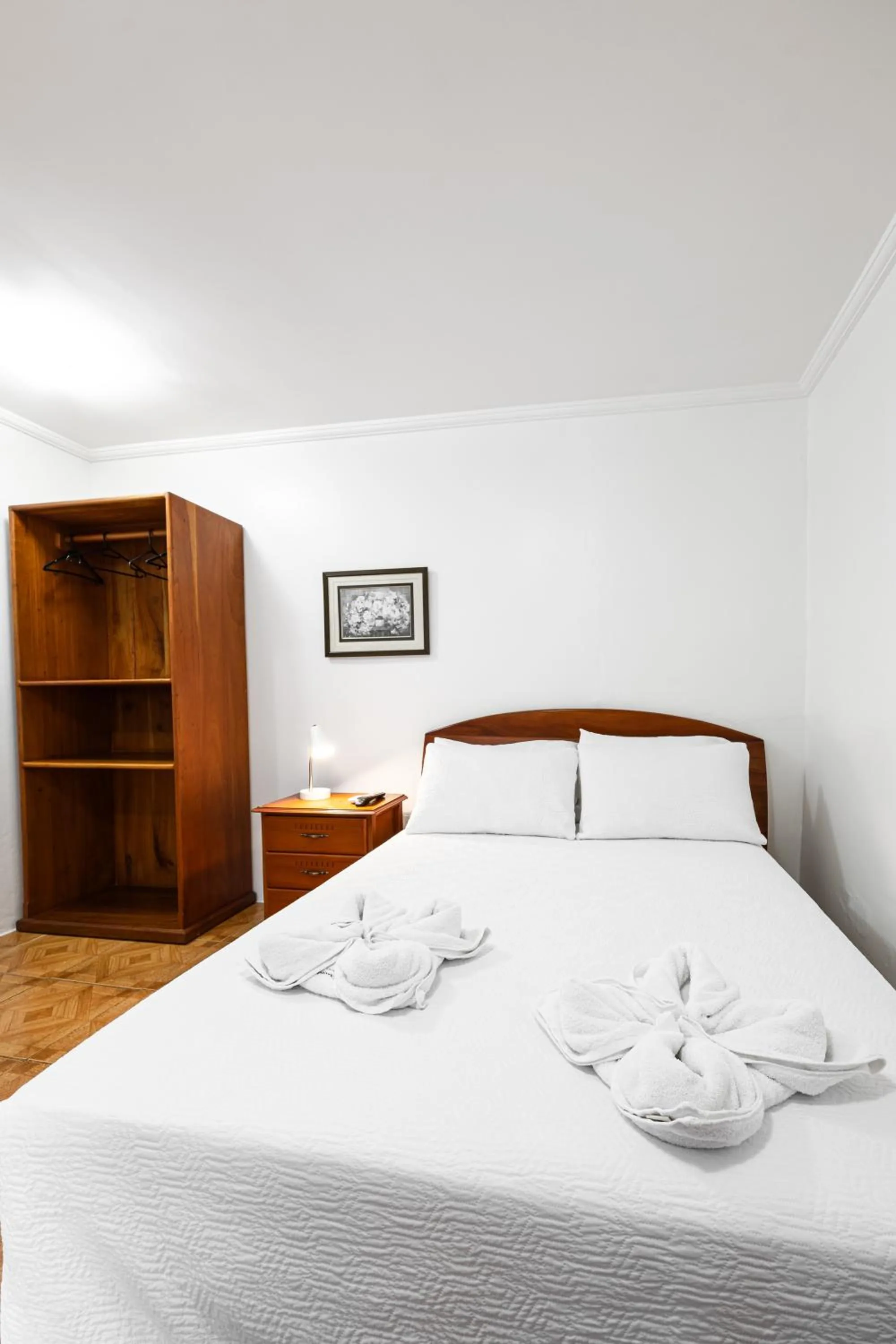 Bed in La Peregrina Galapagos B&B