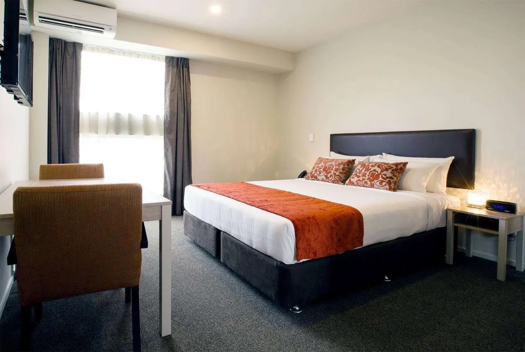 Photo of the whole room, Bed in Ramada Suites by Wyndham Christchurch City Photo of the whole room, Bed in Ramada Suites by Wyndham Christchurch City