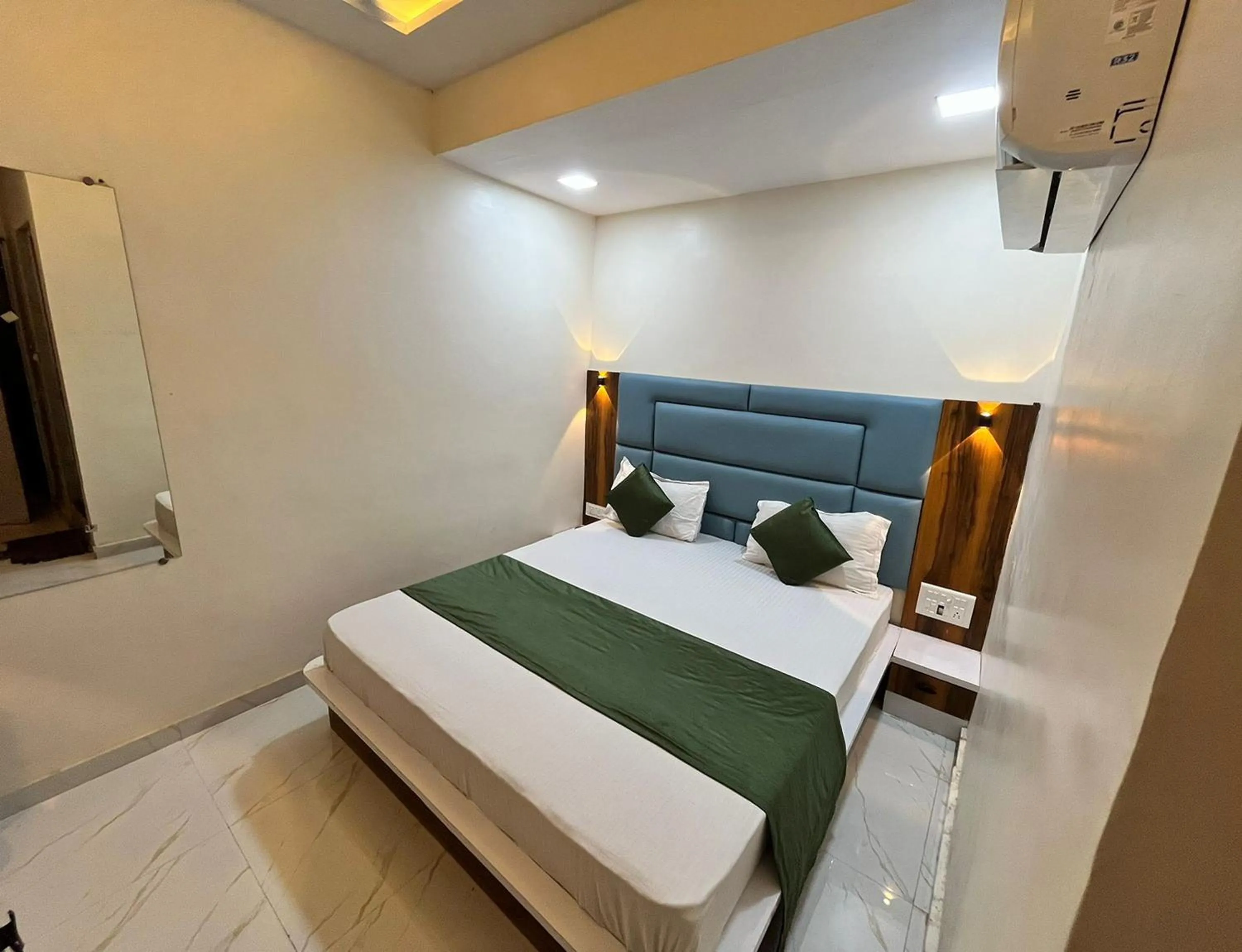 Bedroom in Hotel The Grand Near Maninagar Railway Station Ahmedabad