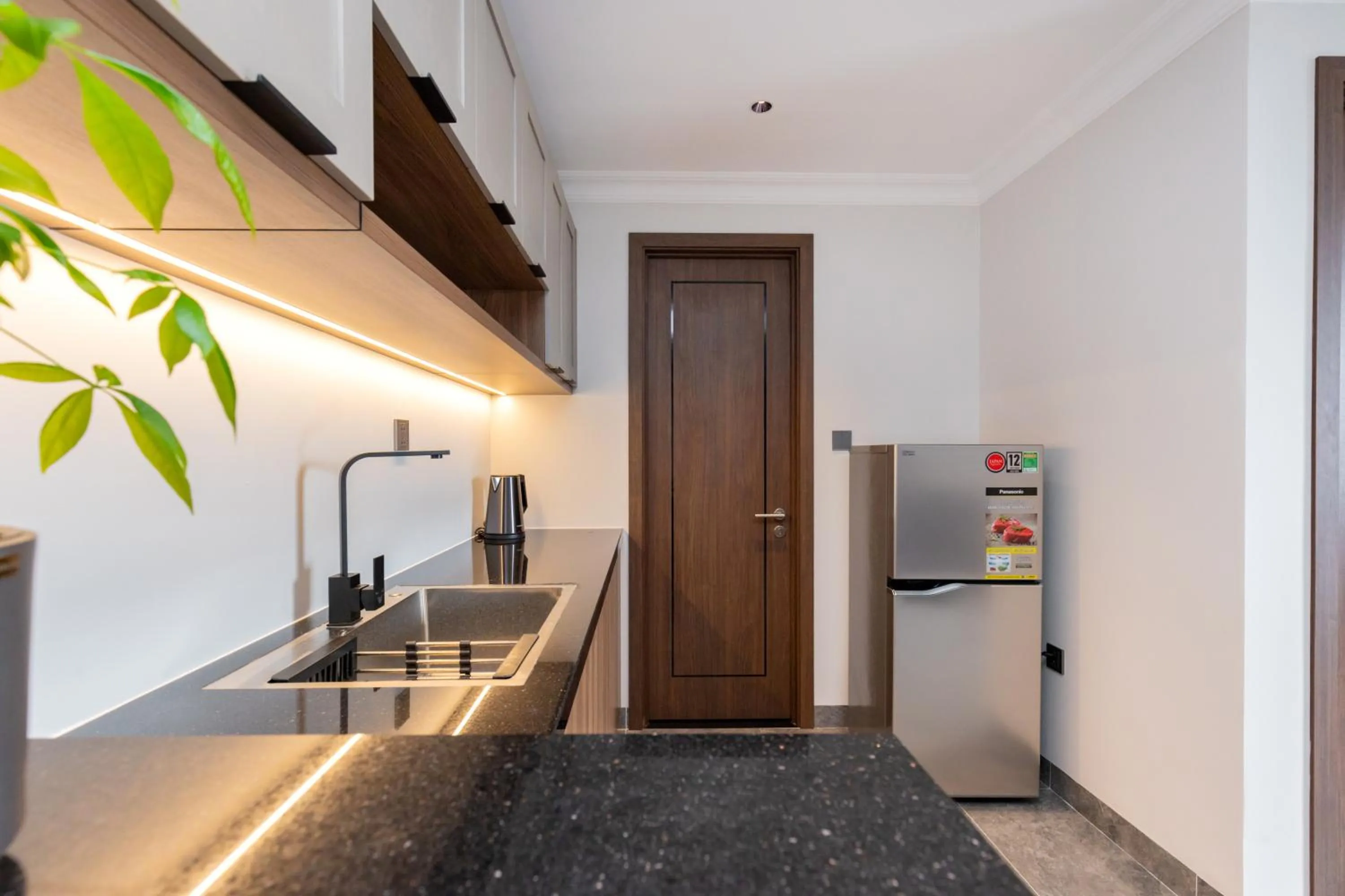 Kitchen or kitchenette in STELLA Hotel & Apartment