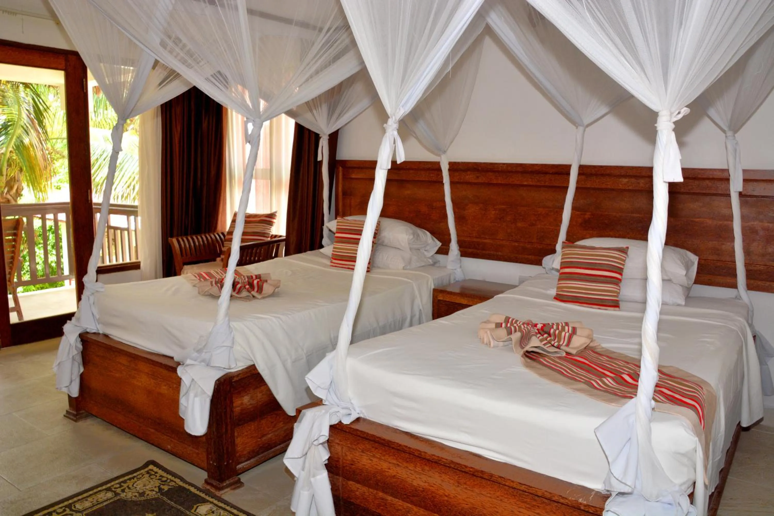 Photo of the whole room, Bed in Zanzibar Bahari Villas