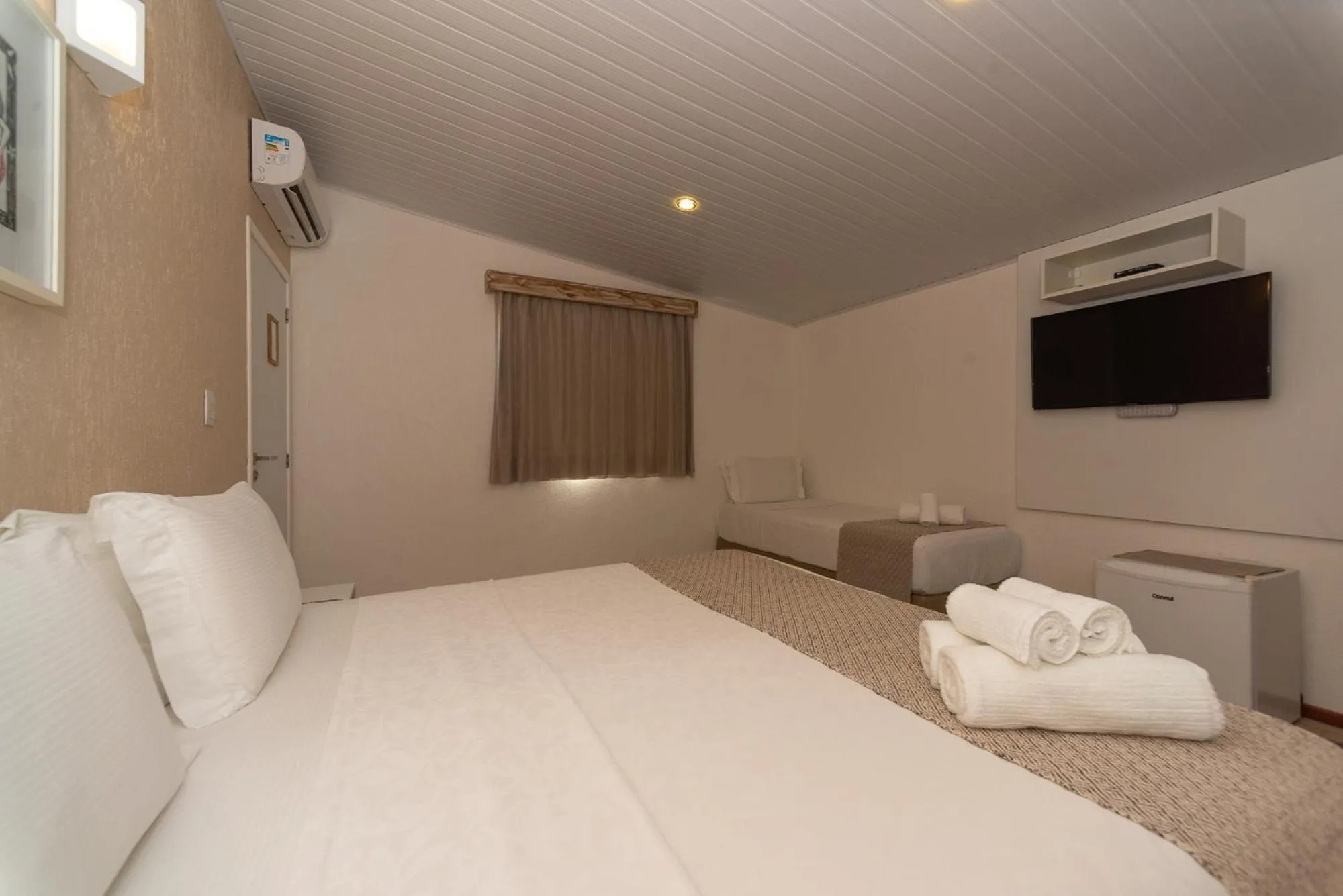 Bed in Pousada Malibu