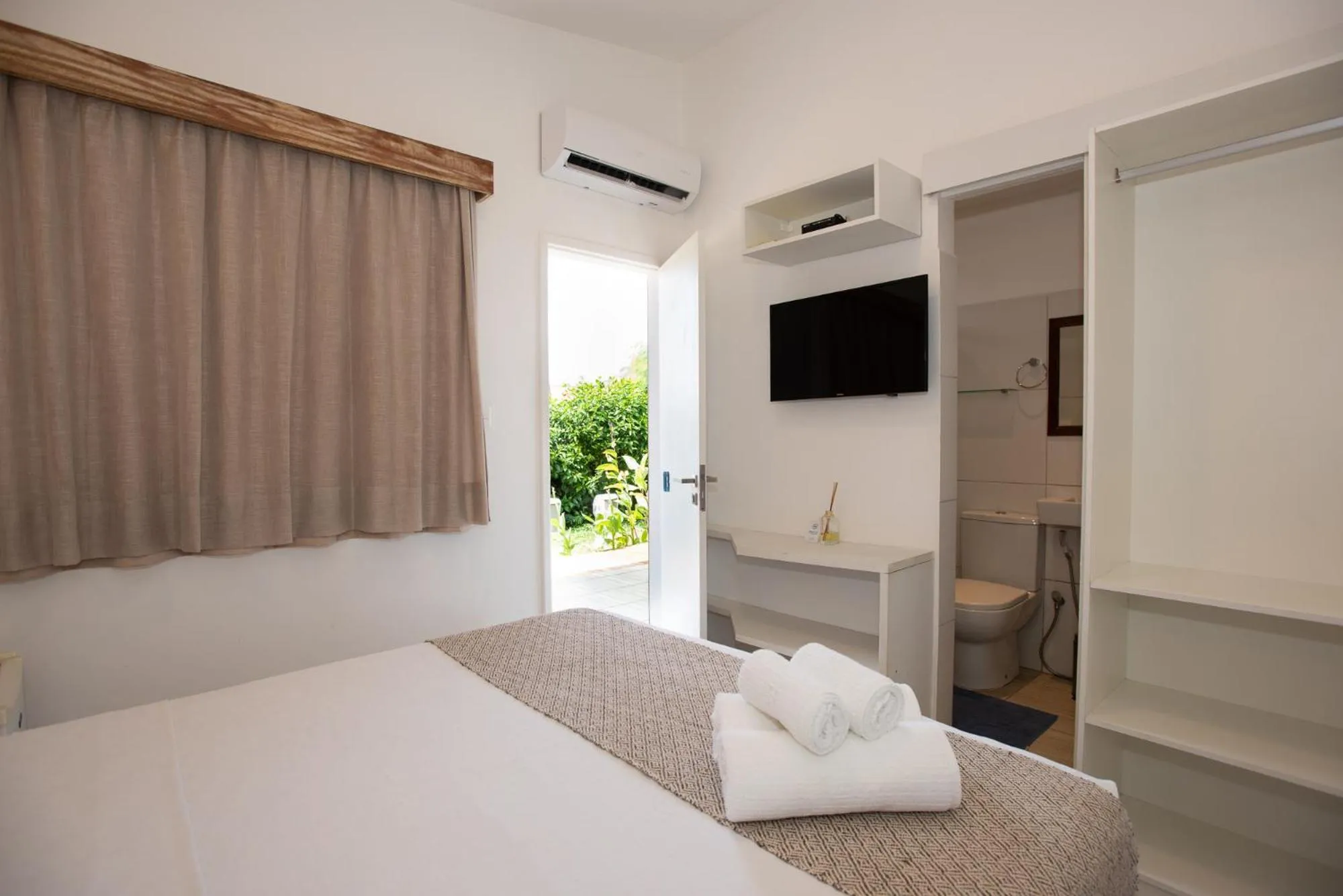 Bed in Pousada Malibu