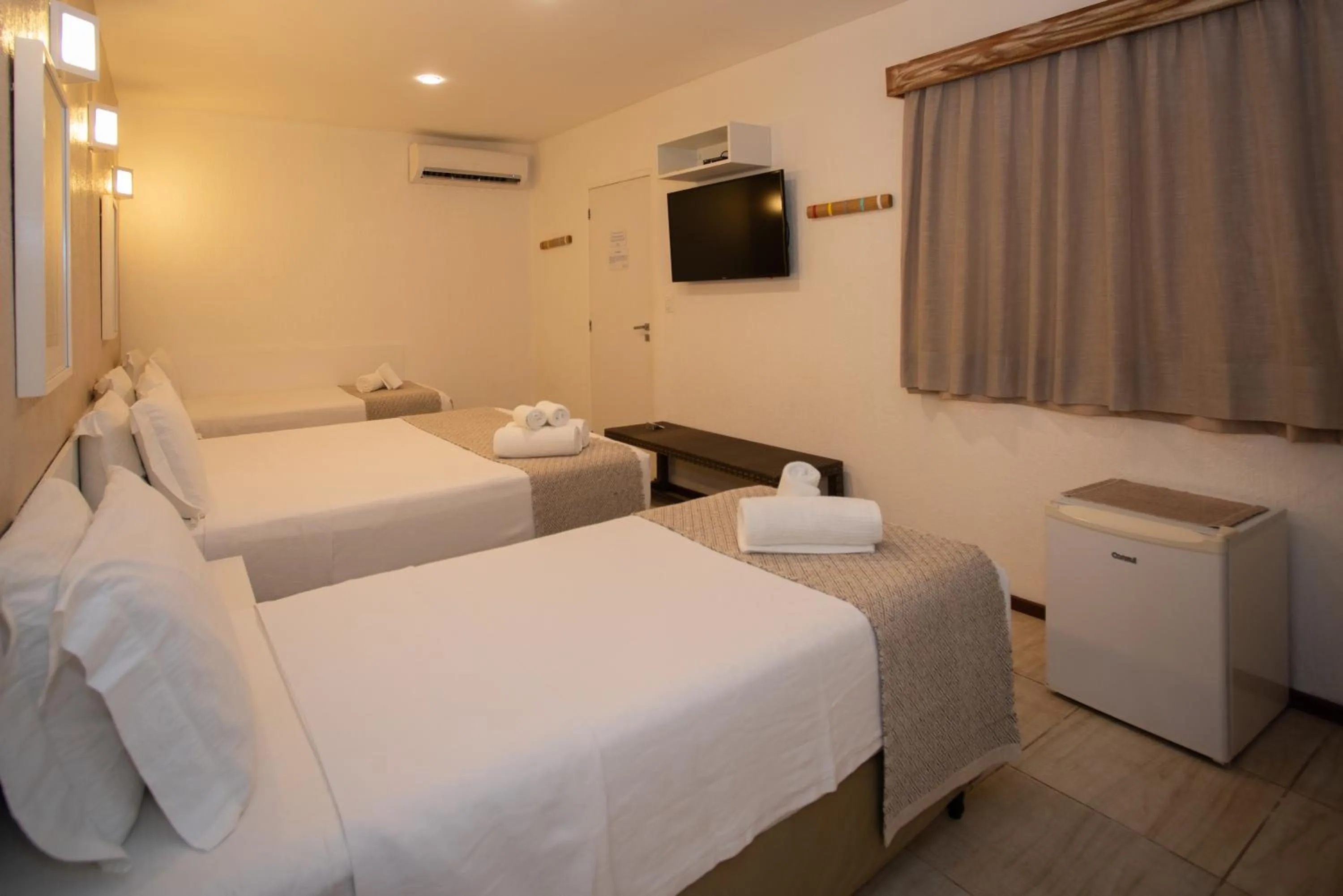 Bed in Pousada Malibu