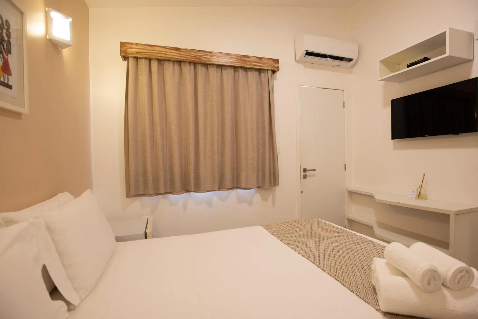 Bed in Pousada Malibu